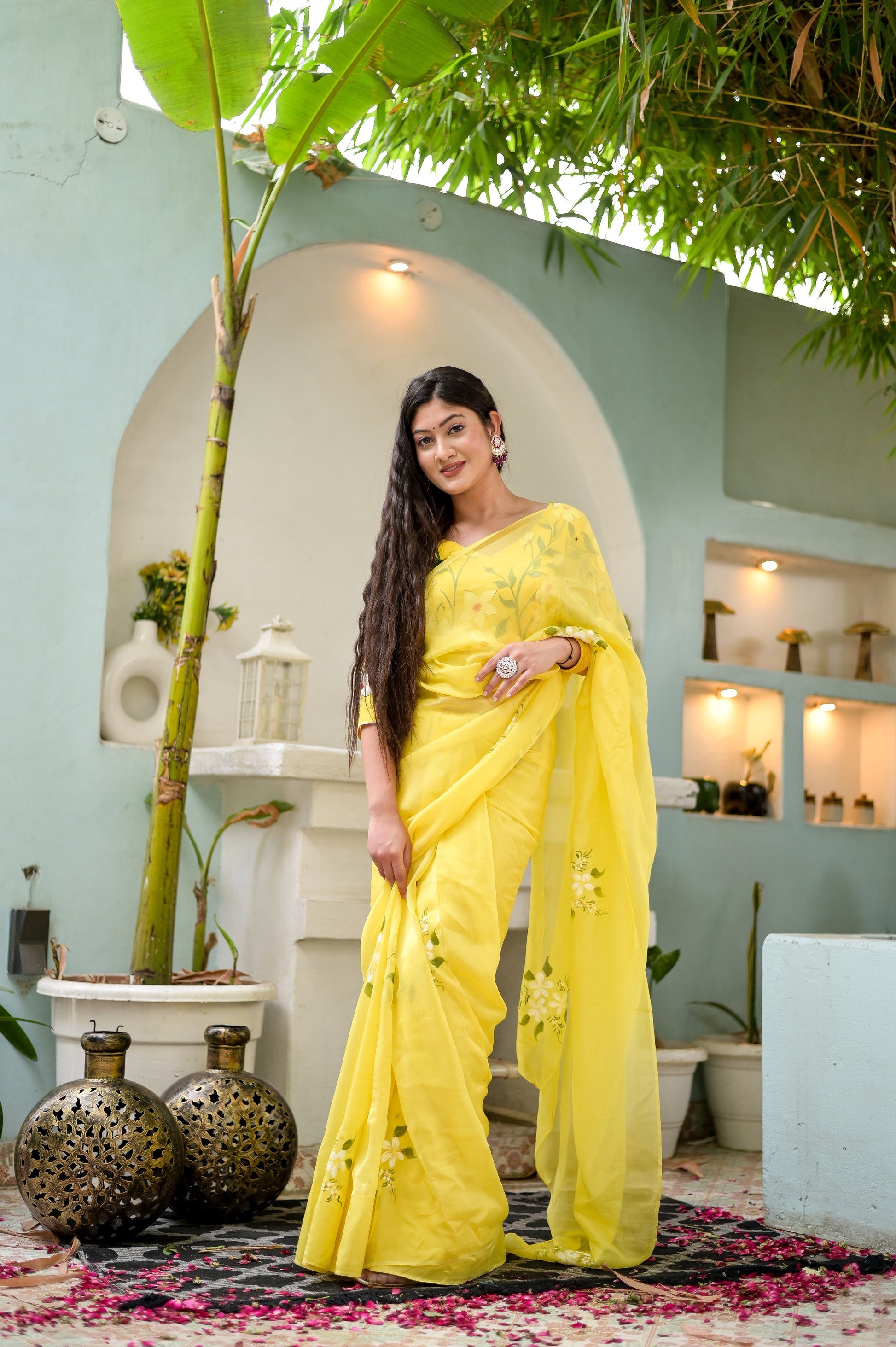 Stunning designer yellow saree hand painted with floral designs, perfect for elegant occasions