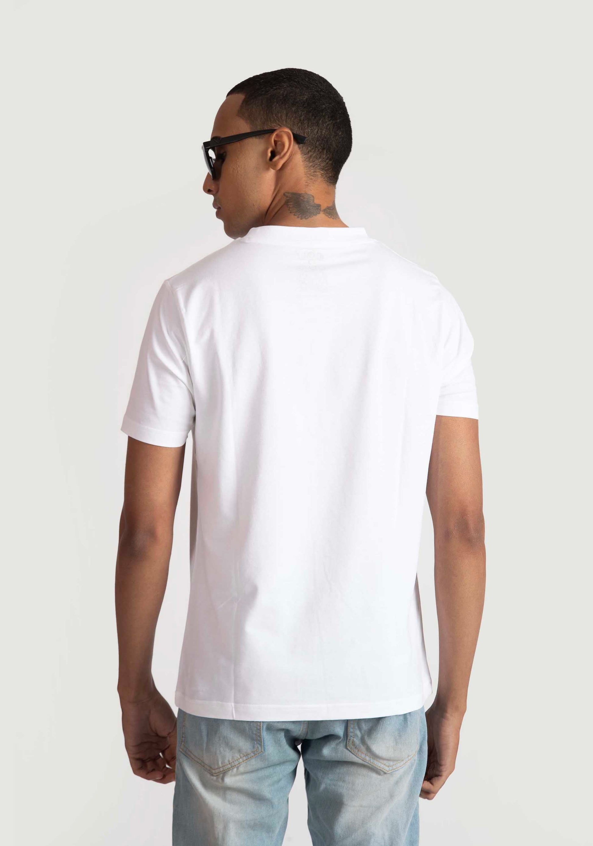 Stylera white regular fit t-shirt shown from back worn by male model with sunglasses