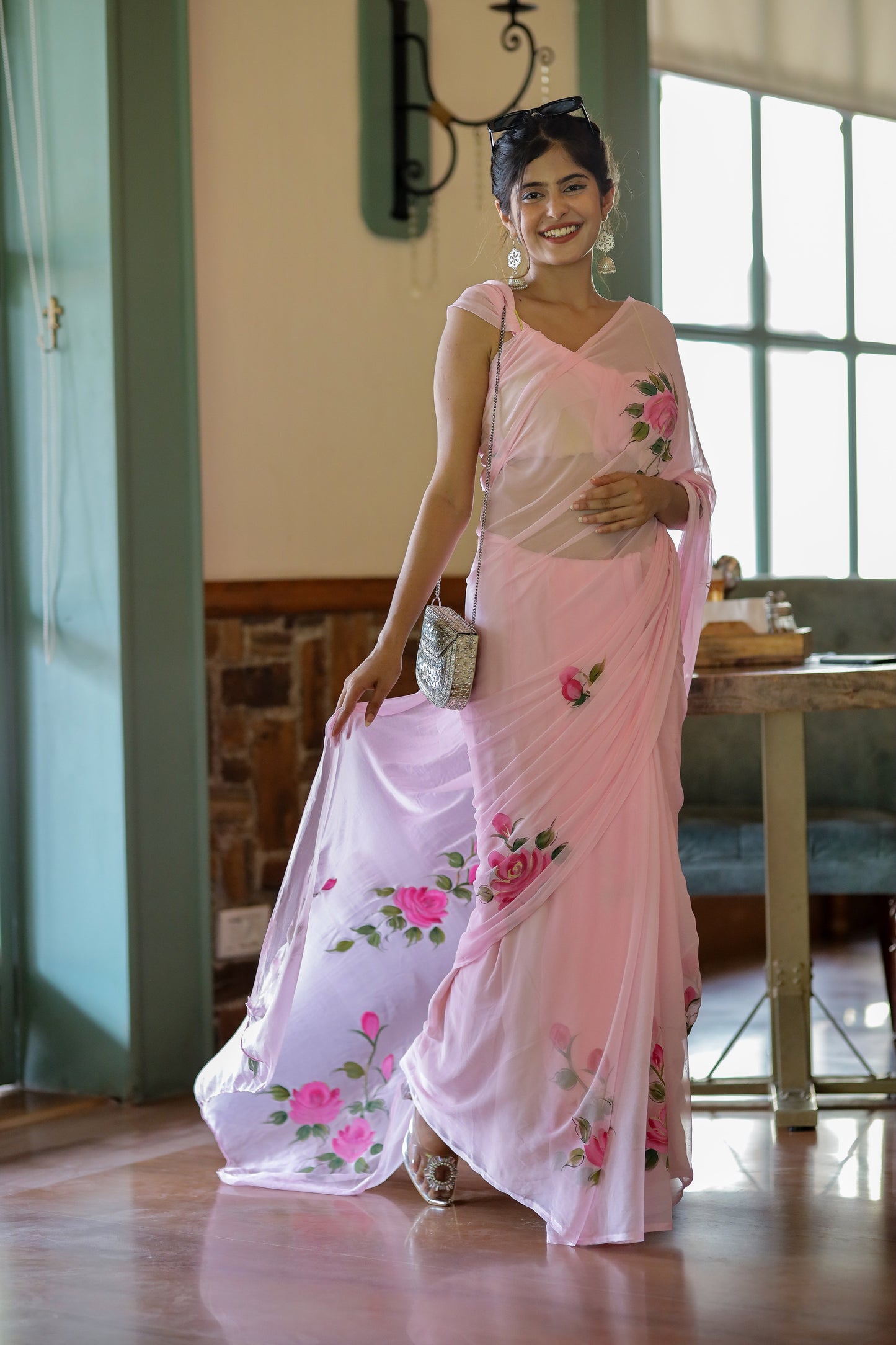 Elegant party wear chiffon saree in pink with floral design, perfect for special occasions