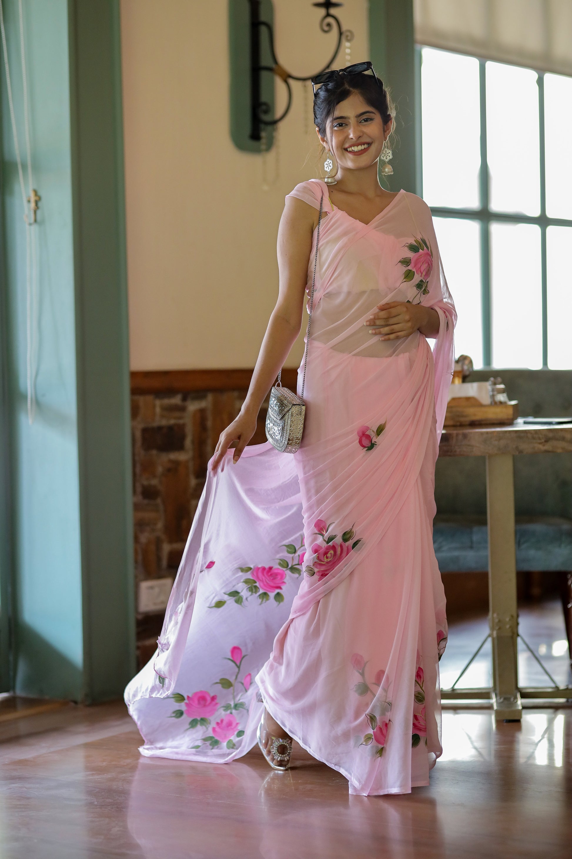 Elegant party wear chiffon saree in pink with floral design, perfect for special occasions