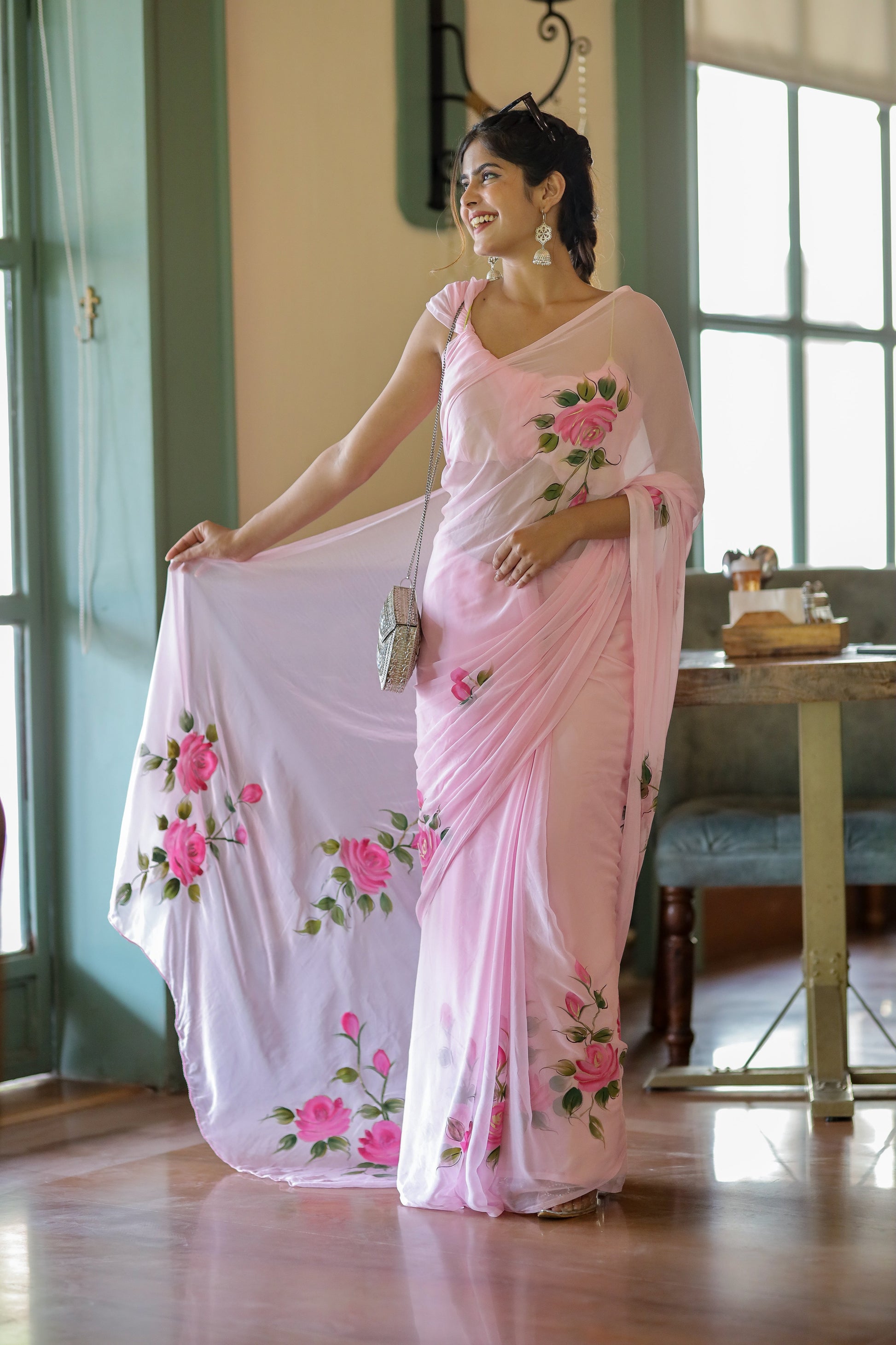 Elegant party wear chiffon saree in soft pink with floral embroidery, perfect for festive occasions