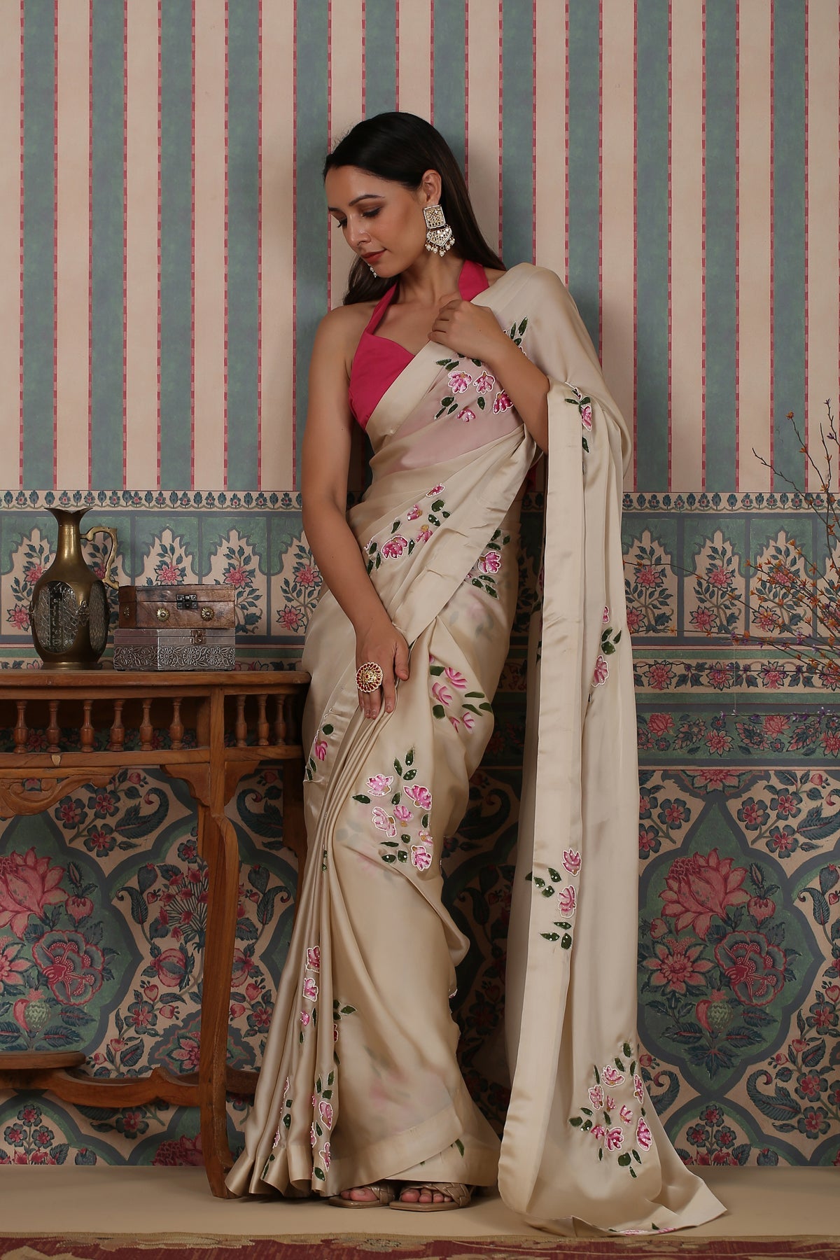 Elegant party wear saree with floral embroidery in cream, styled with a contrasting blouse