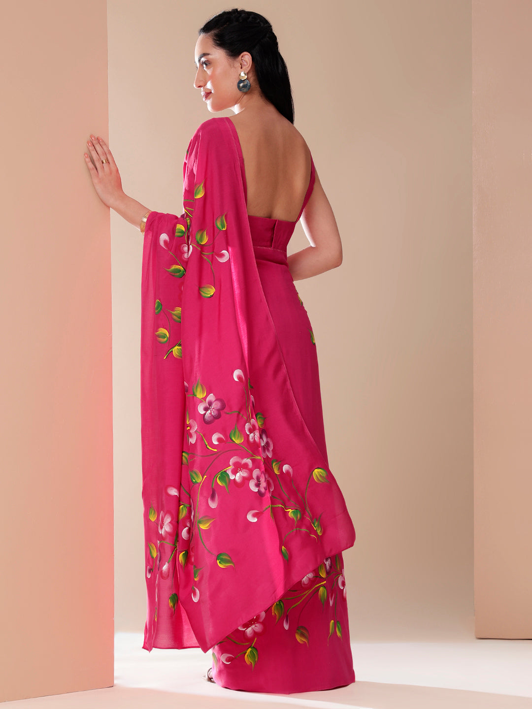 Elegant pink saree for parties featuring floral embroidery and a stylish drape for a chic look