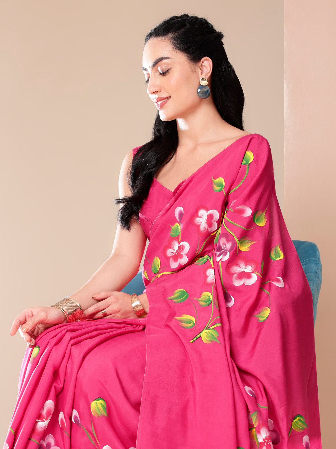 Elegant pink saree for parties featuring floral designs, perfect for festive occasions.