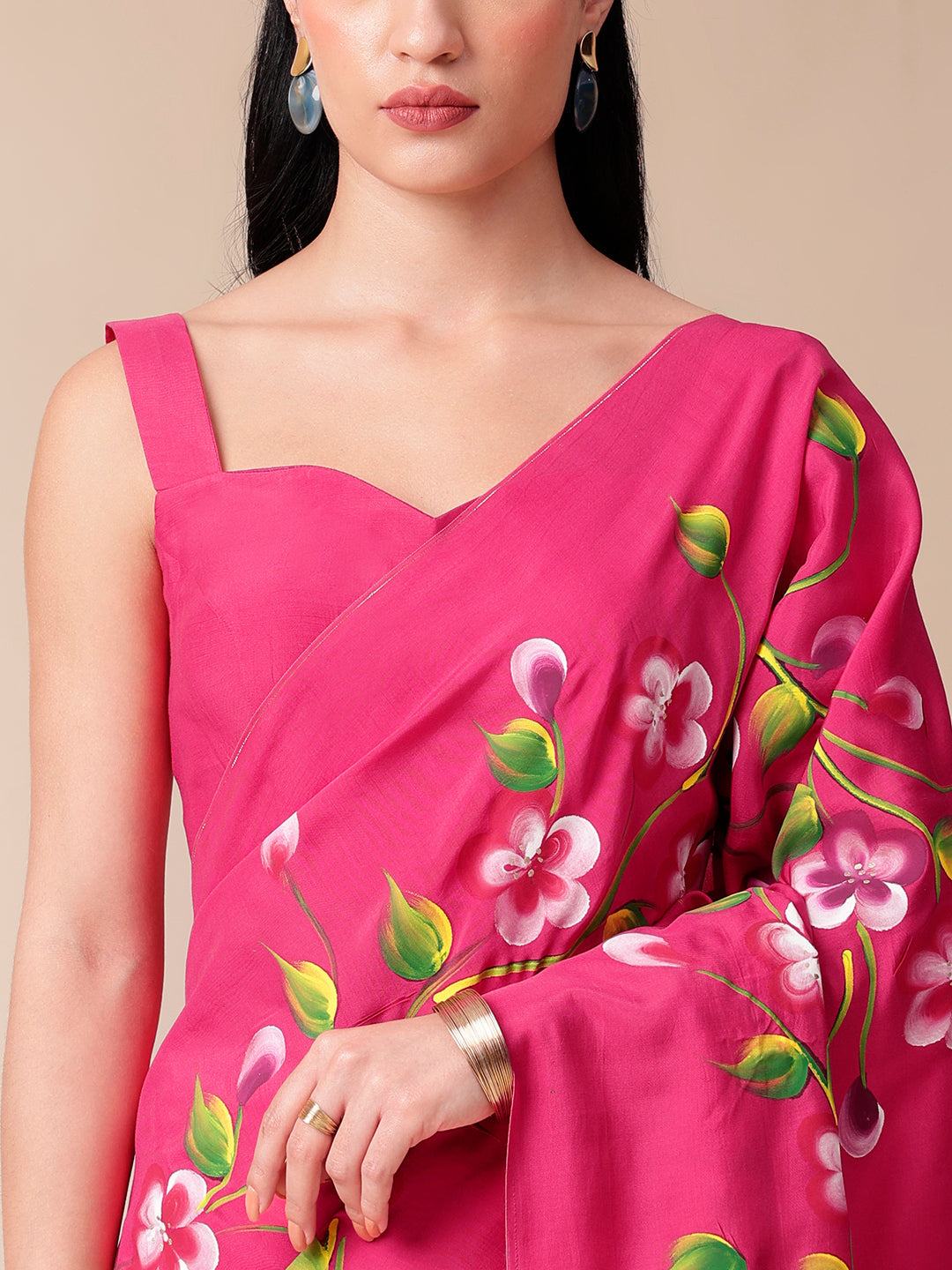 Elegant pink saree for parties featuring vibrant floral prints and stylish design