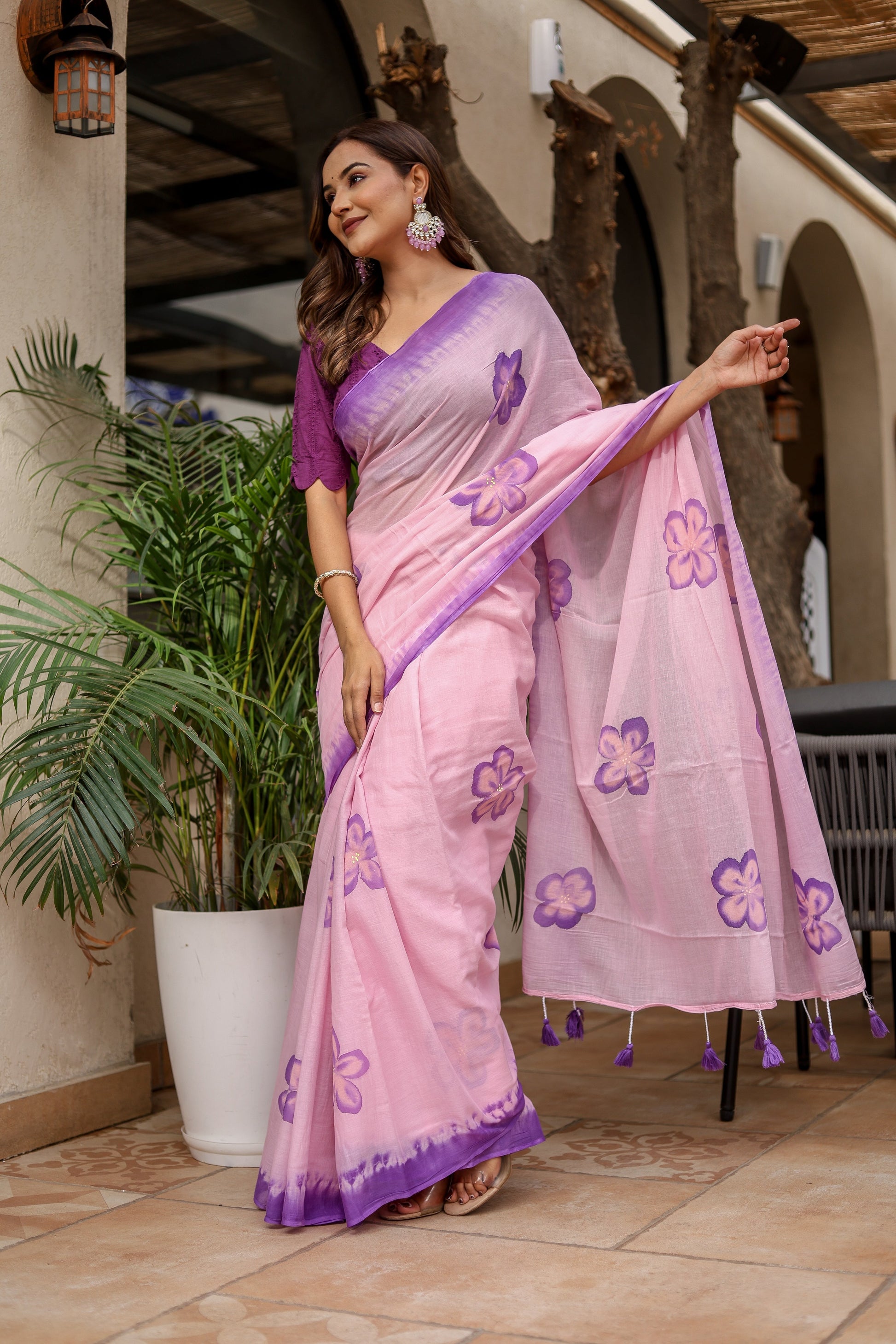 Elegant pink exclusive designer saree for parties featuring floral patterns and intricate details