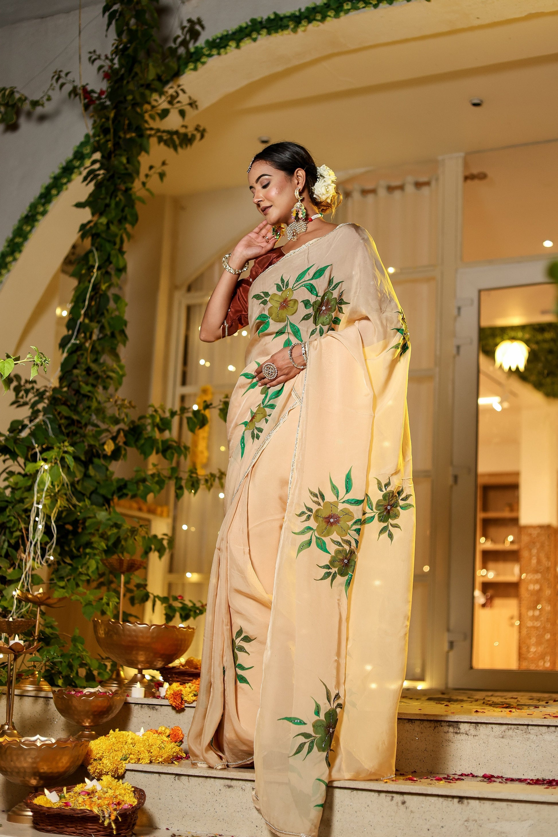 Elegant woman in an exclusive handmade Indian saree with vibrant floral designs, perfect for festive occasions