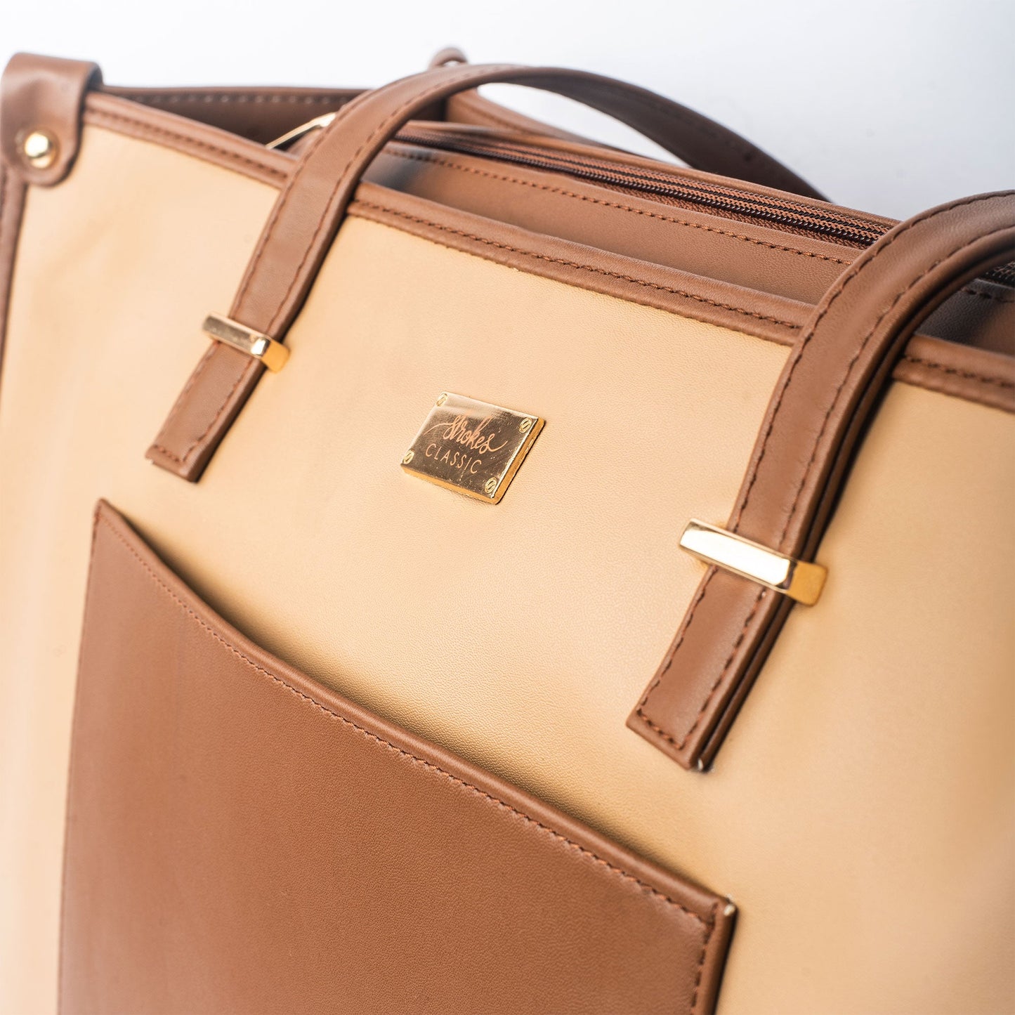 Stylera fashionable brown tote purse with gold accents and exterior pocket