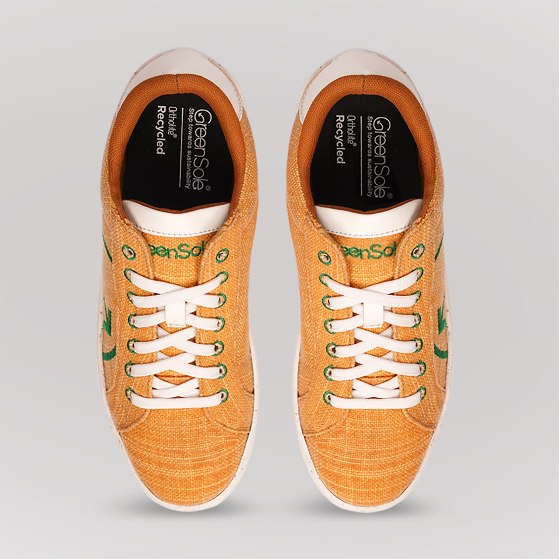 Top view of fashionable yellow casual sneakers by Stylera with white laces and eco-friendly design