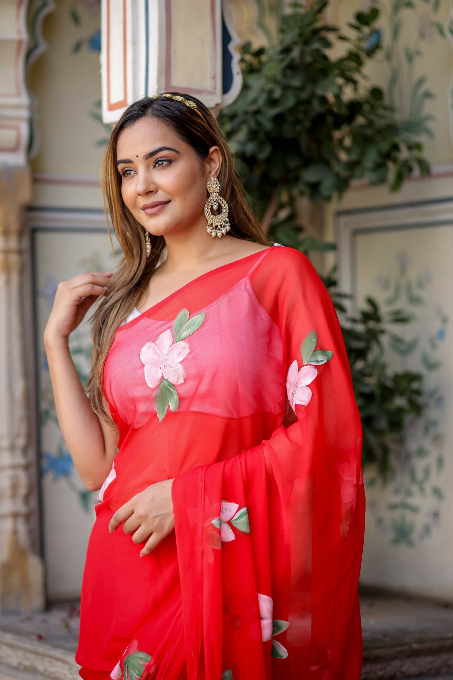 Elegant floral designer chiffon saree in vibrant red with floral embellishments perfect for festive occasions