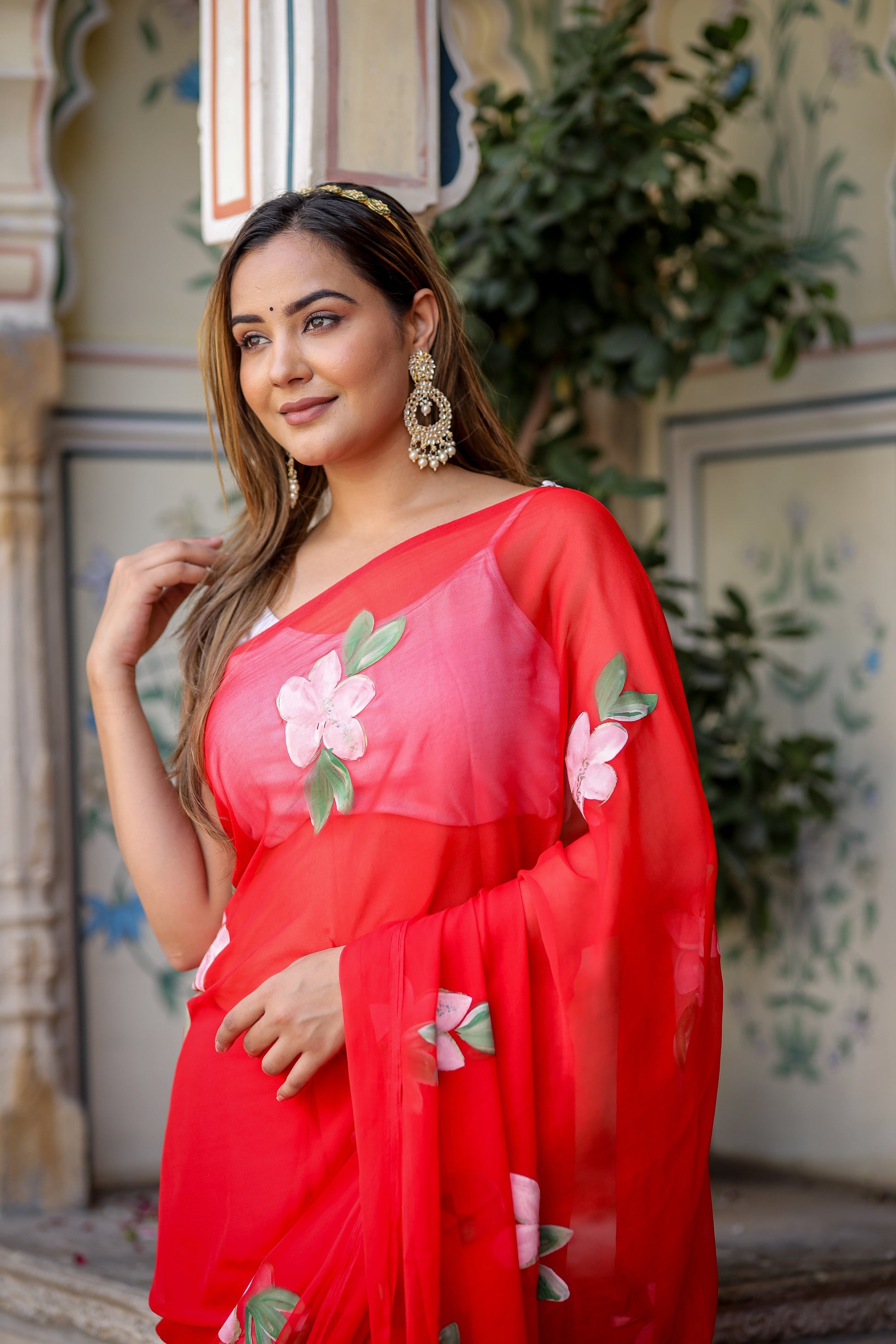 Elegant floral designer chiffon saree in vibrant red with floral embellishments perfect for festive occasions
