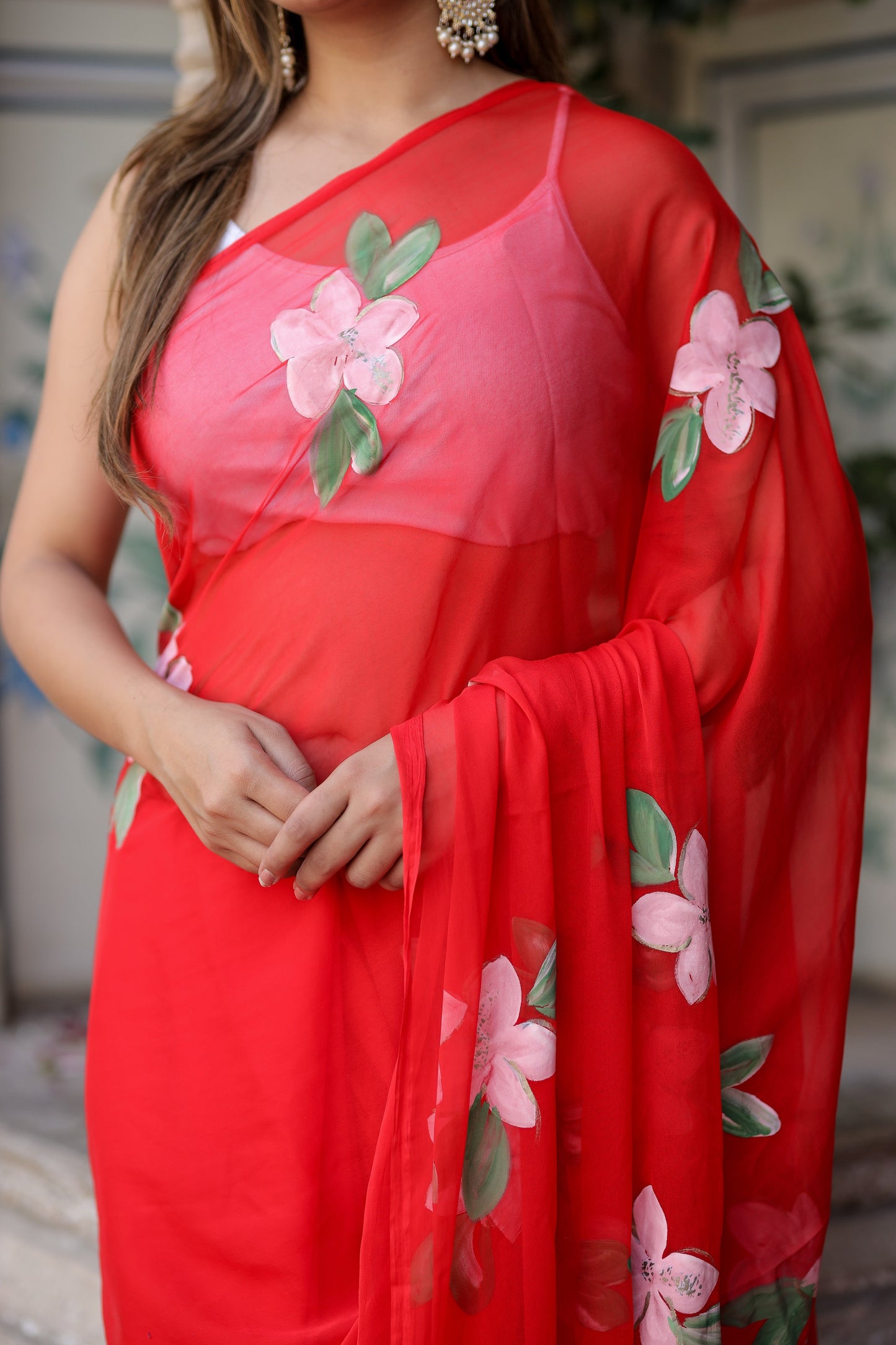 Floral designer chiffon saree in vibrant red with beautiful floral embroidery on the pallu