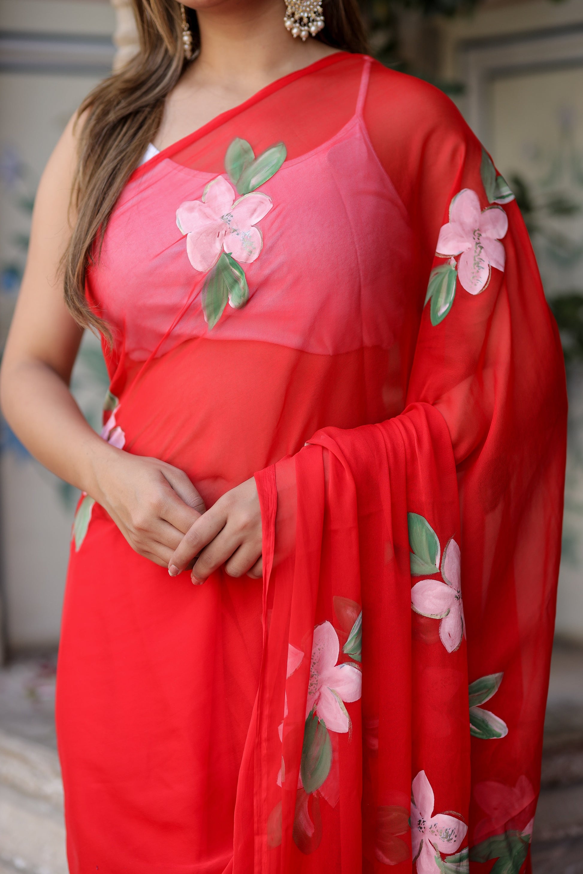 Floral designer chiffon saree in vibrant red with beautiful floral embroidery on the pallu
