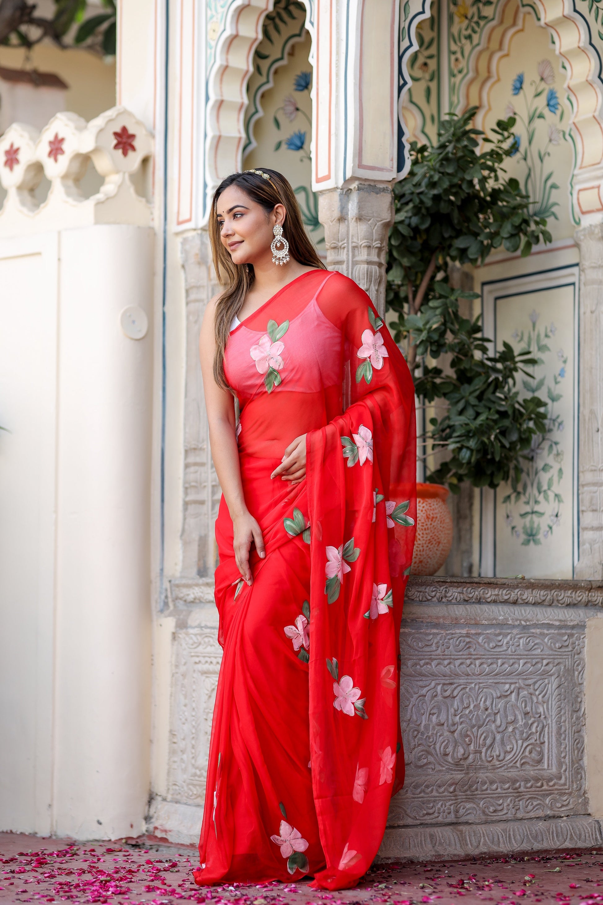 Elegant floral designer chiffon saree in red with floral embroidery, styled for a traditional look
