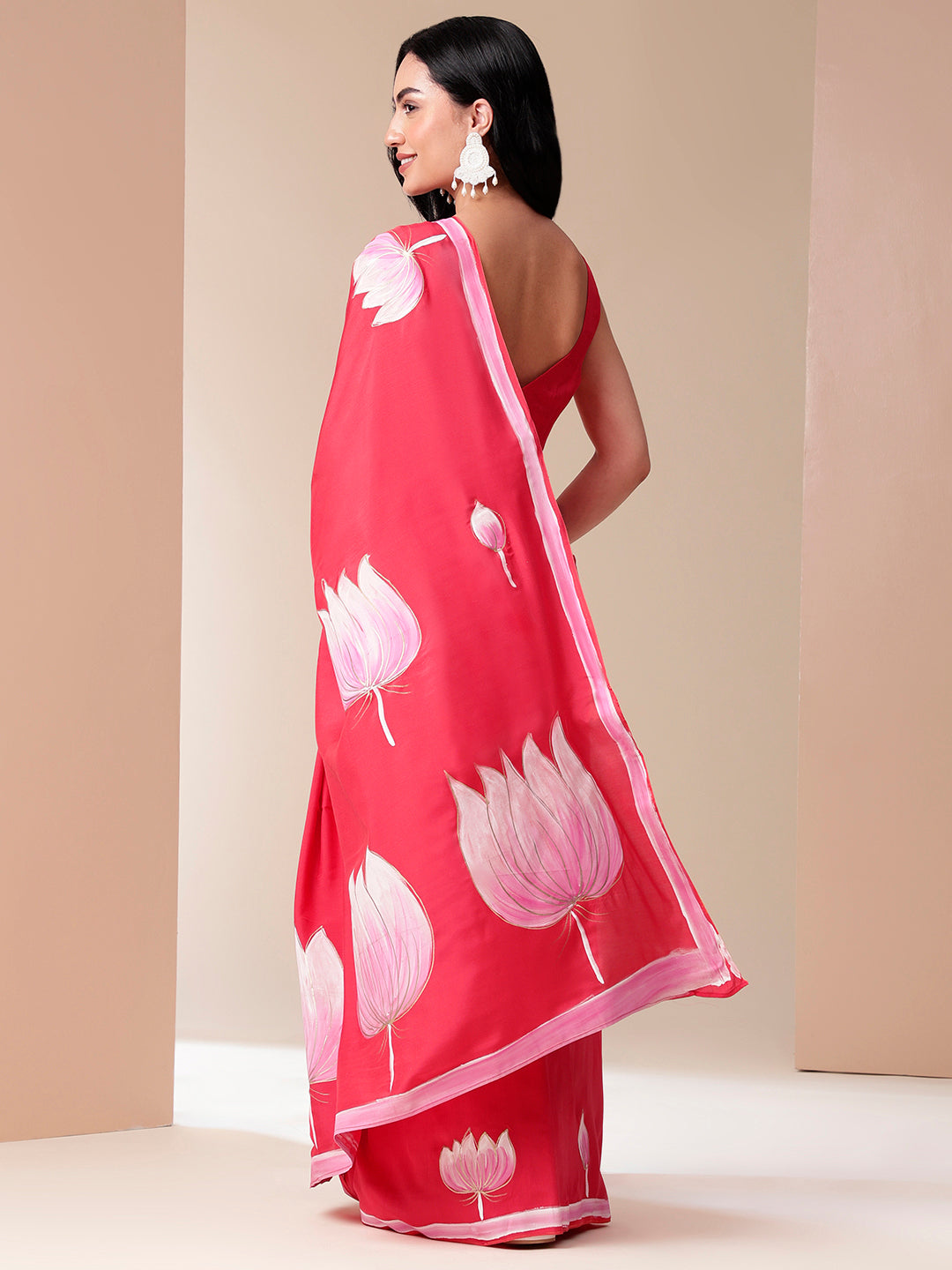 Elegant floral designer mal mal saree in vibrant pink with beautiful lotus prints for special occasions