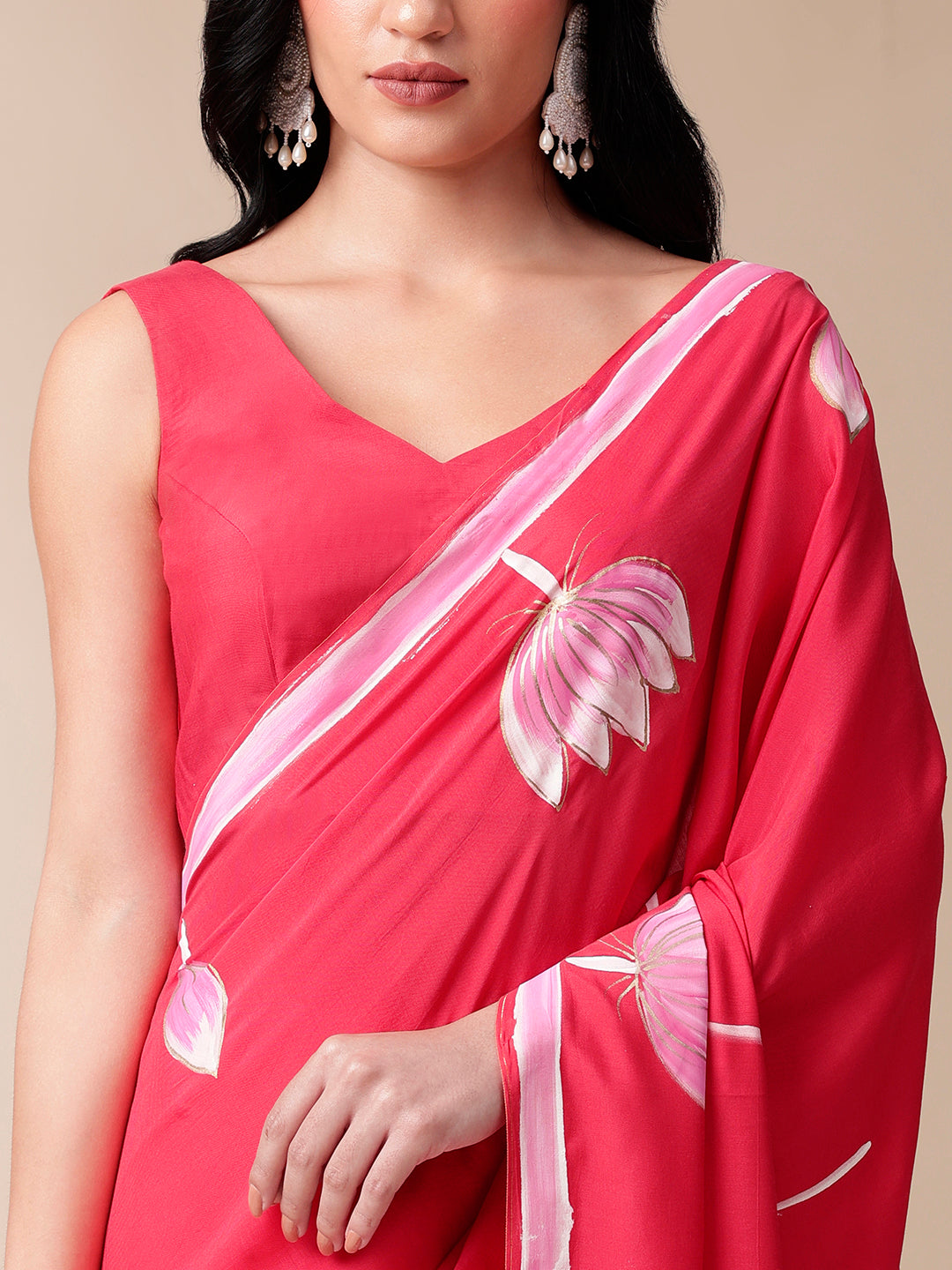Elegant pink floral designer mal mal saree with beautiful floral patterns and a graceful drape