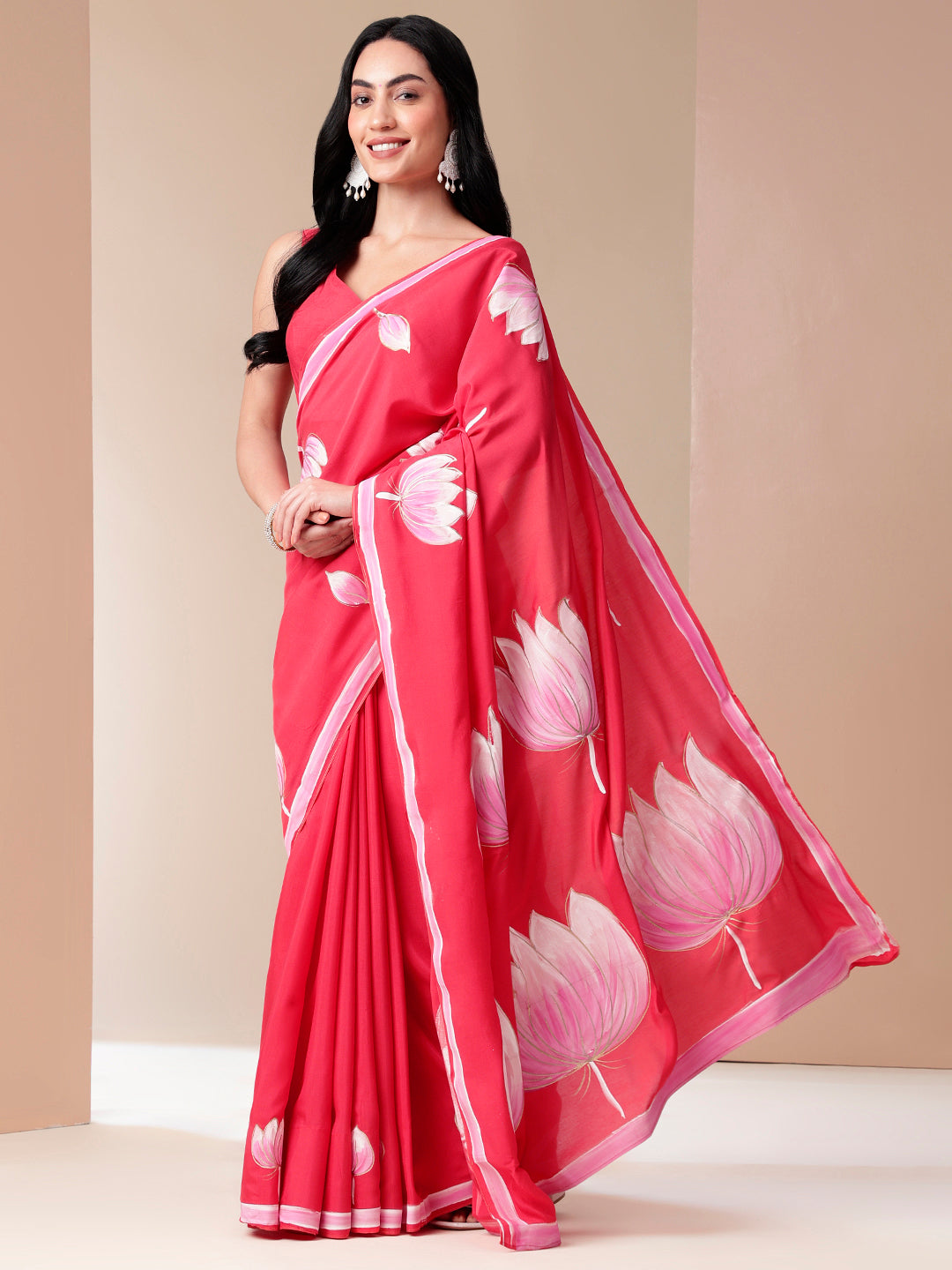 Elegant floral designer mal mal saree in vibrant pink with lotus motifs for special occasions