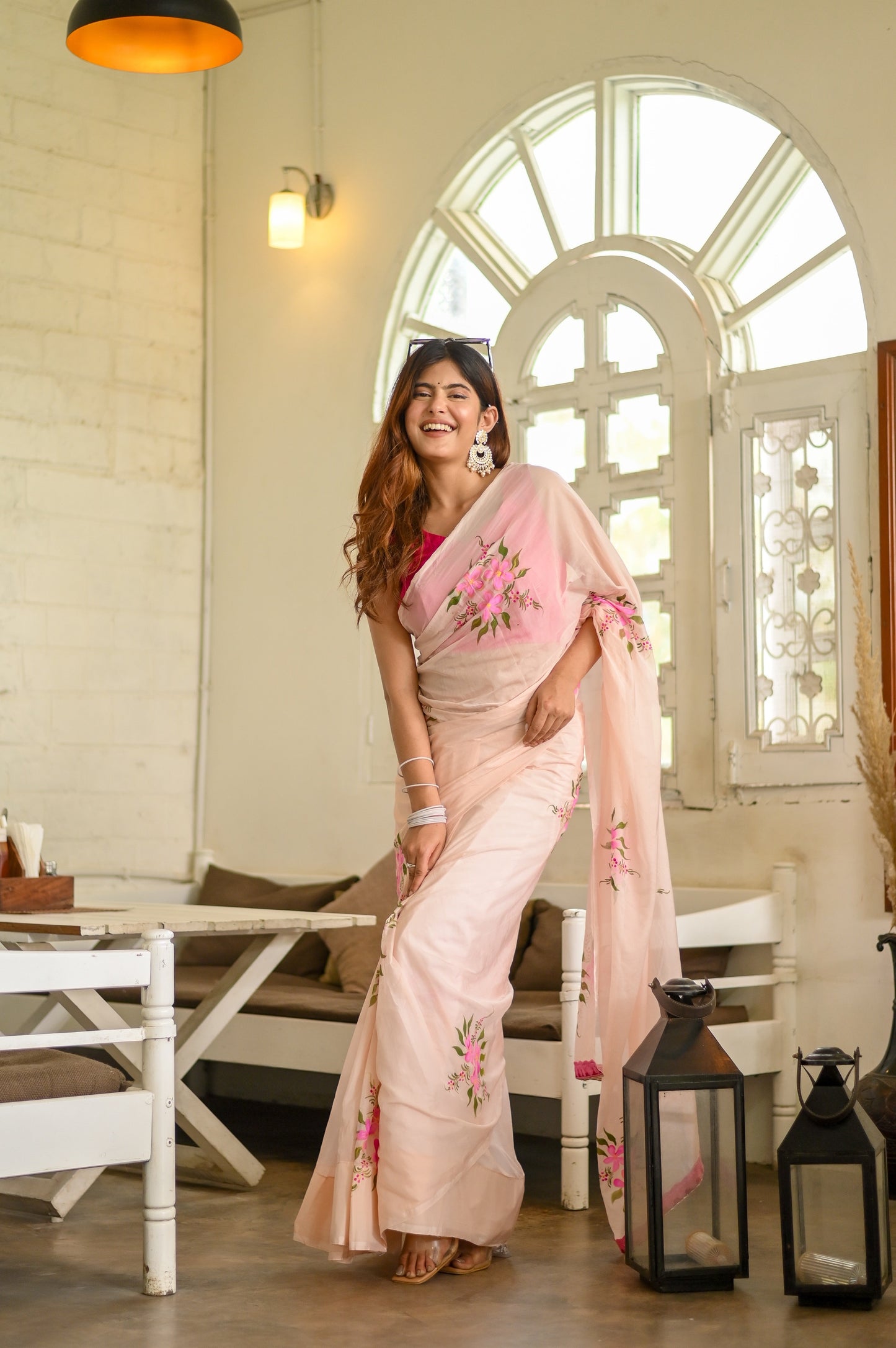 Elegant floral organza saree for women in soft pink with floral embroidery, styled for a festive look