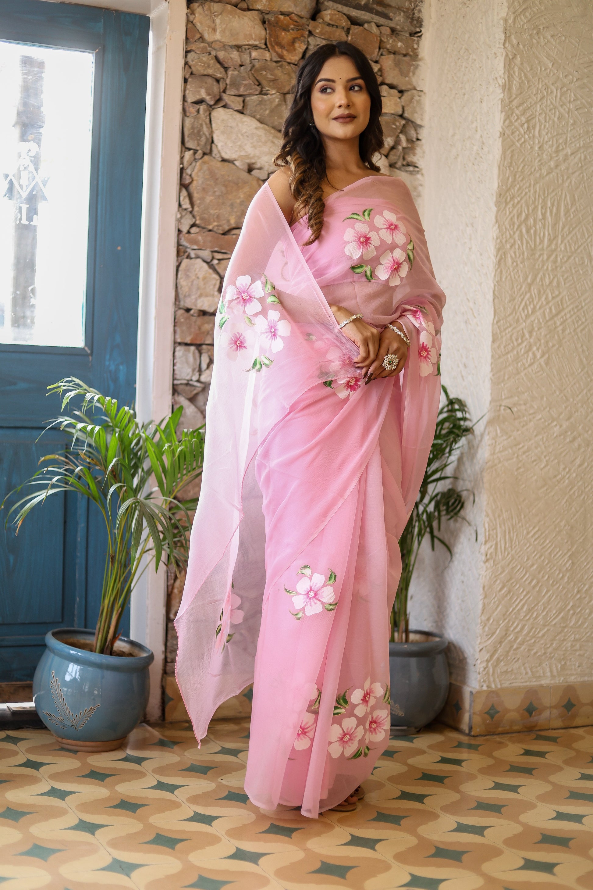 Elegant floral pink saree for women with intricate flower embroidery, perfect for festive occasions