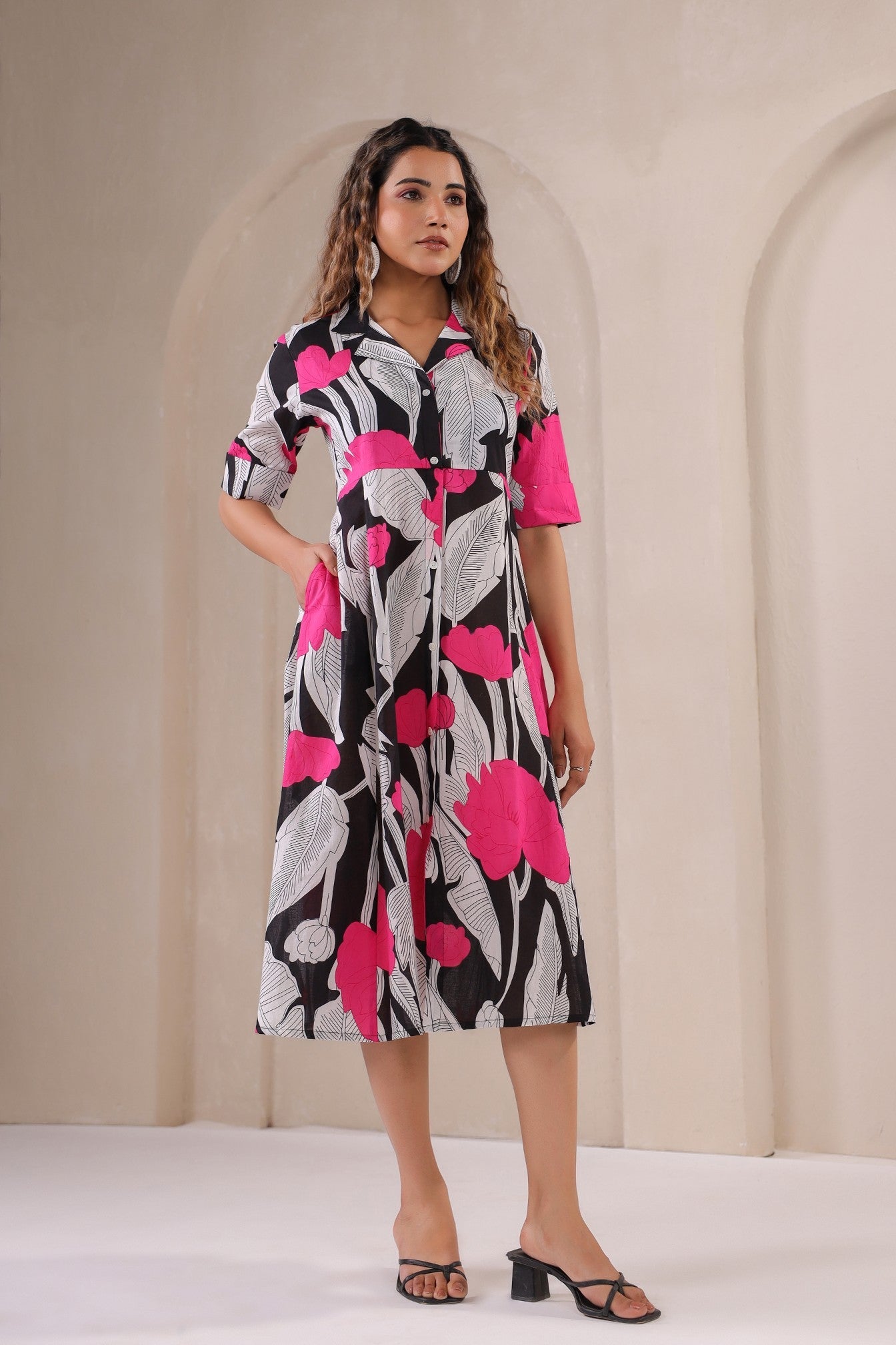 Floral print midi dress by Stylera with bold pink and black design, perfect for casual outings.