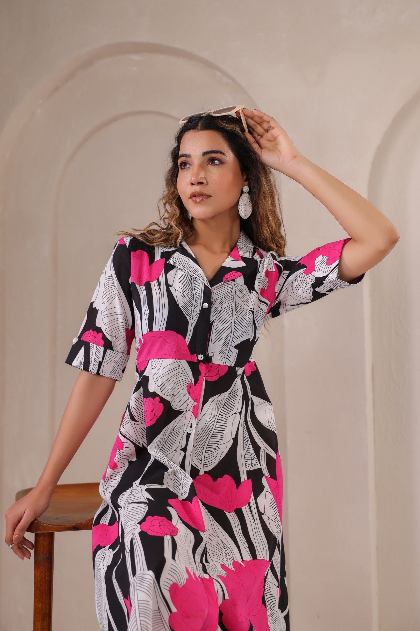 Floral print midi dress by Stylera featuring vibrant pink and black leaf patterns