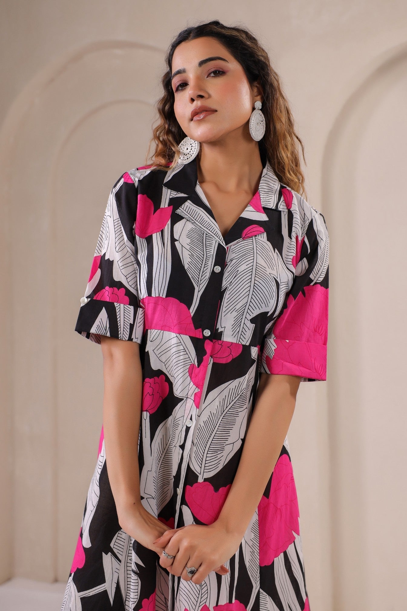 Floral print midi dress by Stylera with short sleeves and button-up design in vibrant black and pink