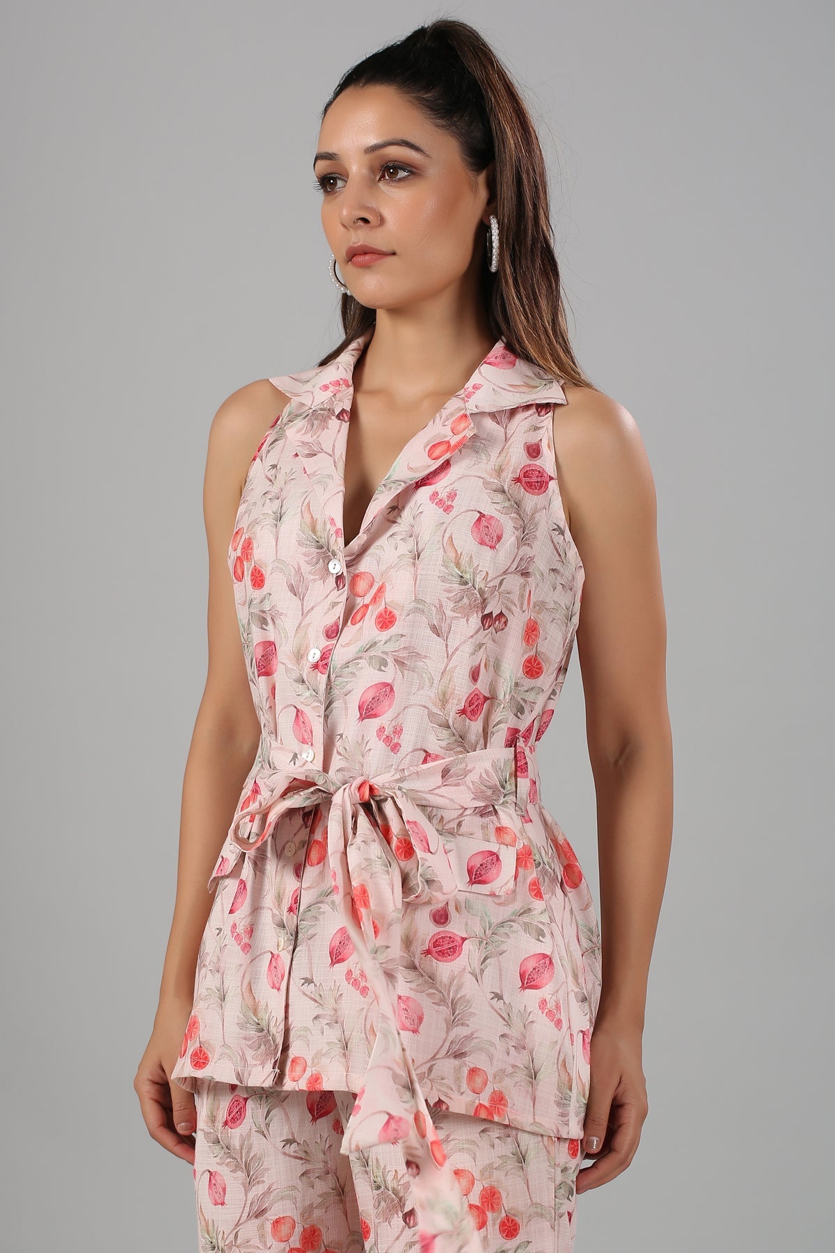 Floral printed two piece set for women featuring a sleeveless top with belt and floral patterns