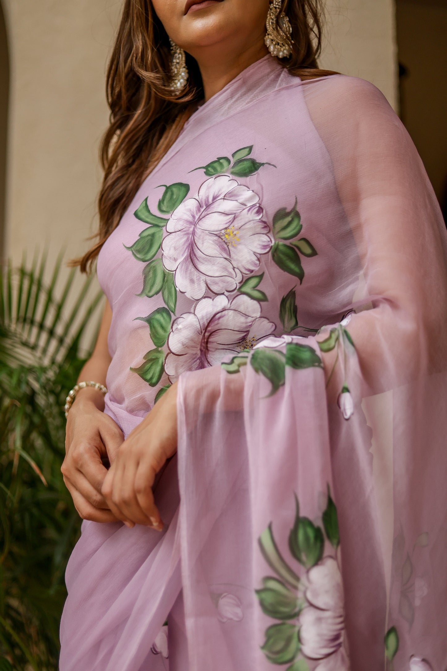 Elegant floral statement saree in soft lavender with vibrant flower embroidery for special occasions
