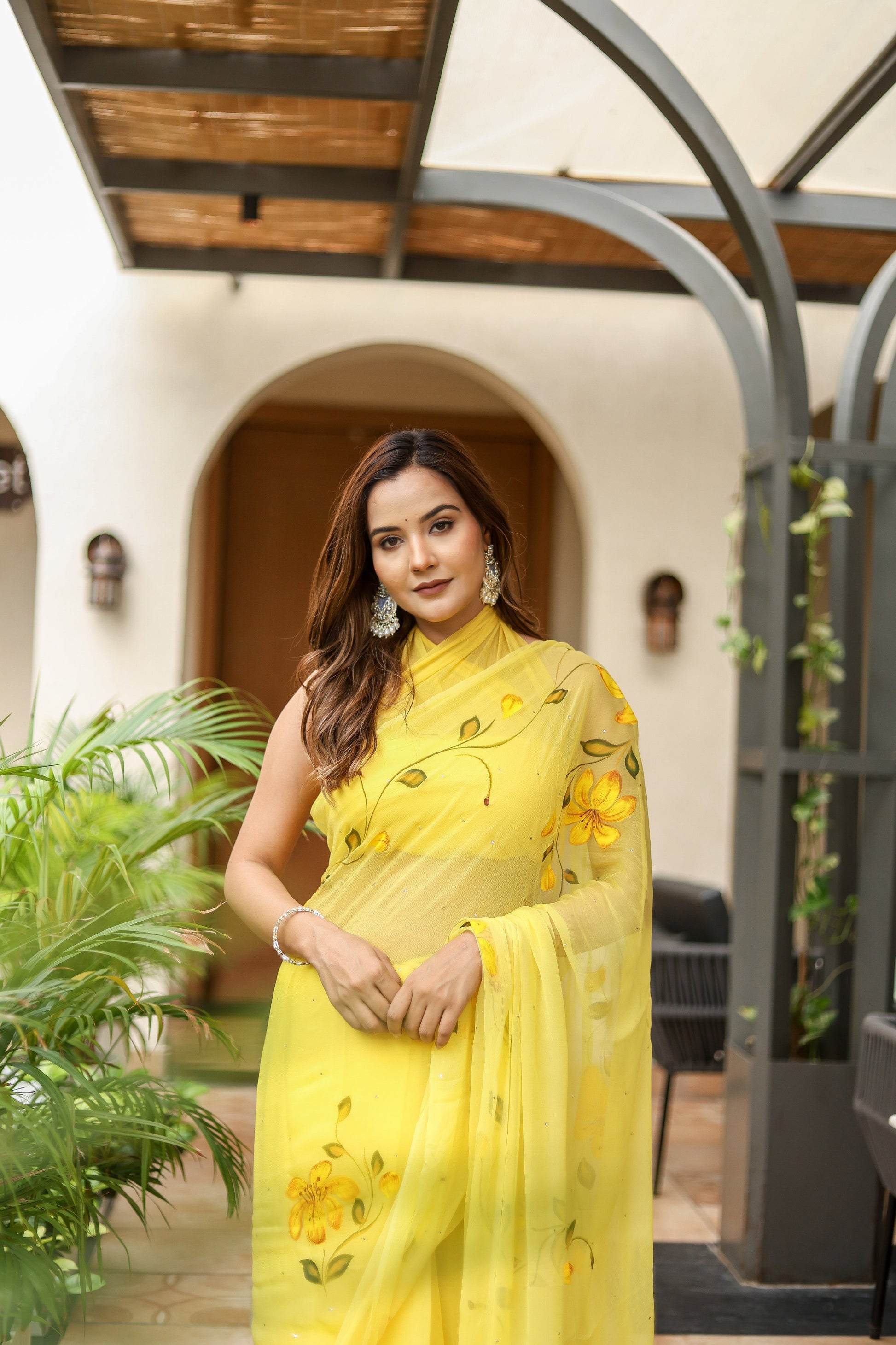 Yellow floral viscose chiffon saree with mukaish work, elegant design for special occasions.