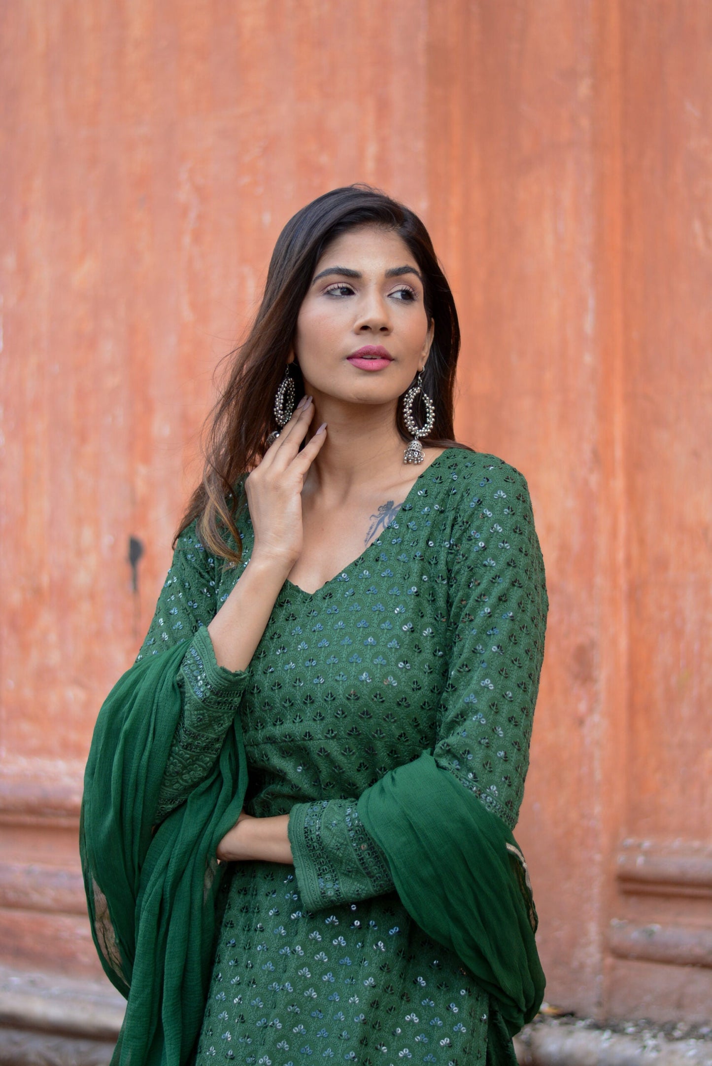 Elegant green three piece suit for women with intricate embroidery and matching dupatta by Stylera