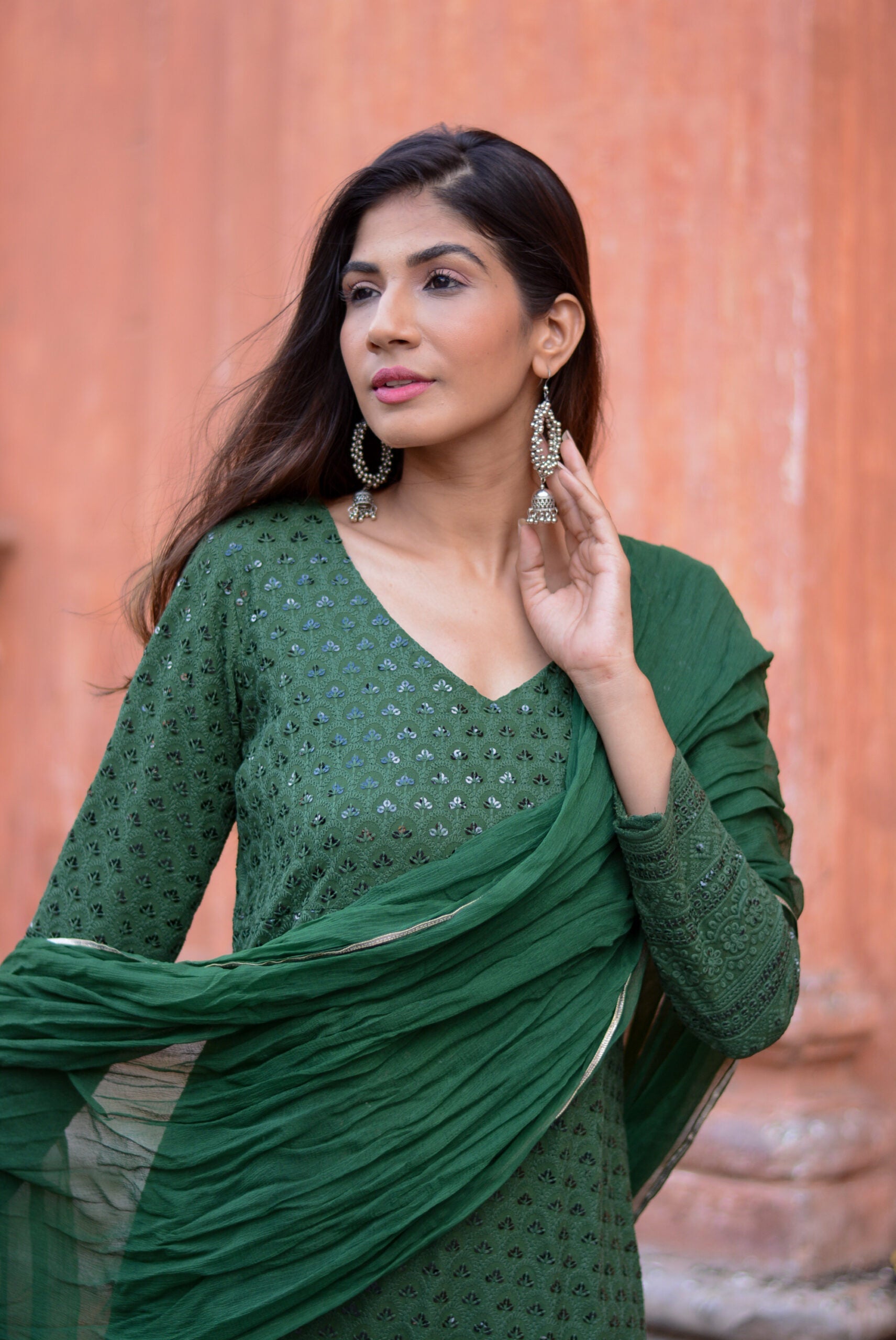 Elegant green three piece suit for women with detailed embroidery and matching dupatta by Stylera
