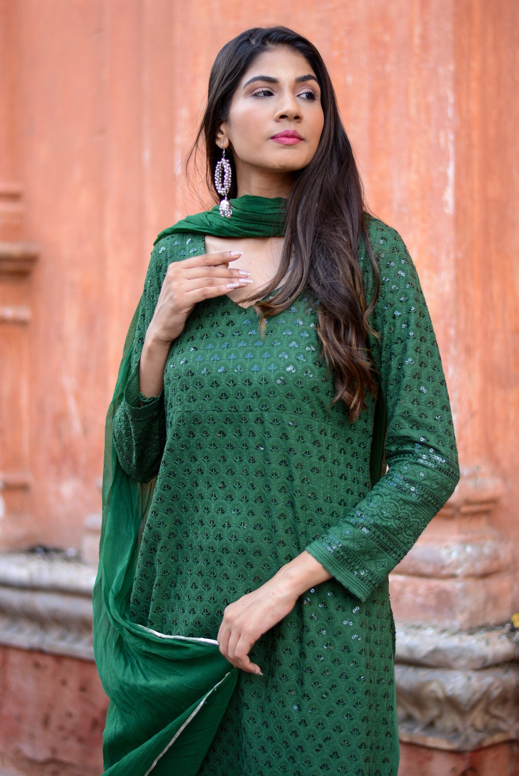 Elegant green three piece suit for women featuring detailed embroidery & matching dupatta by Stylera