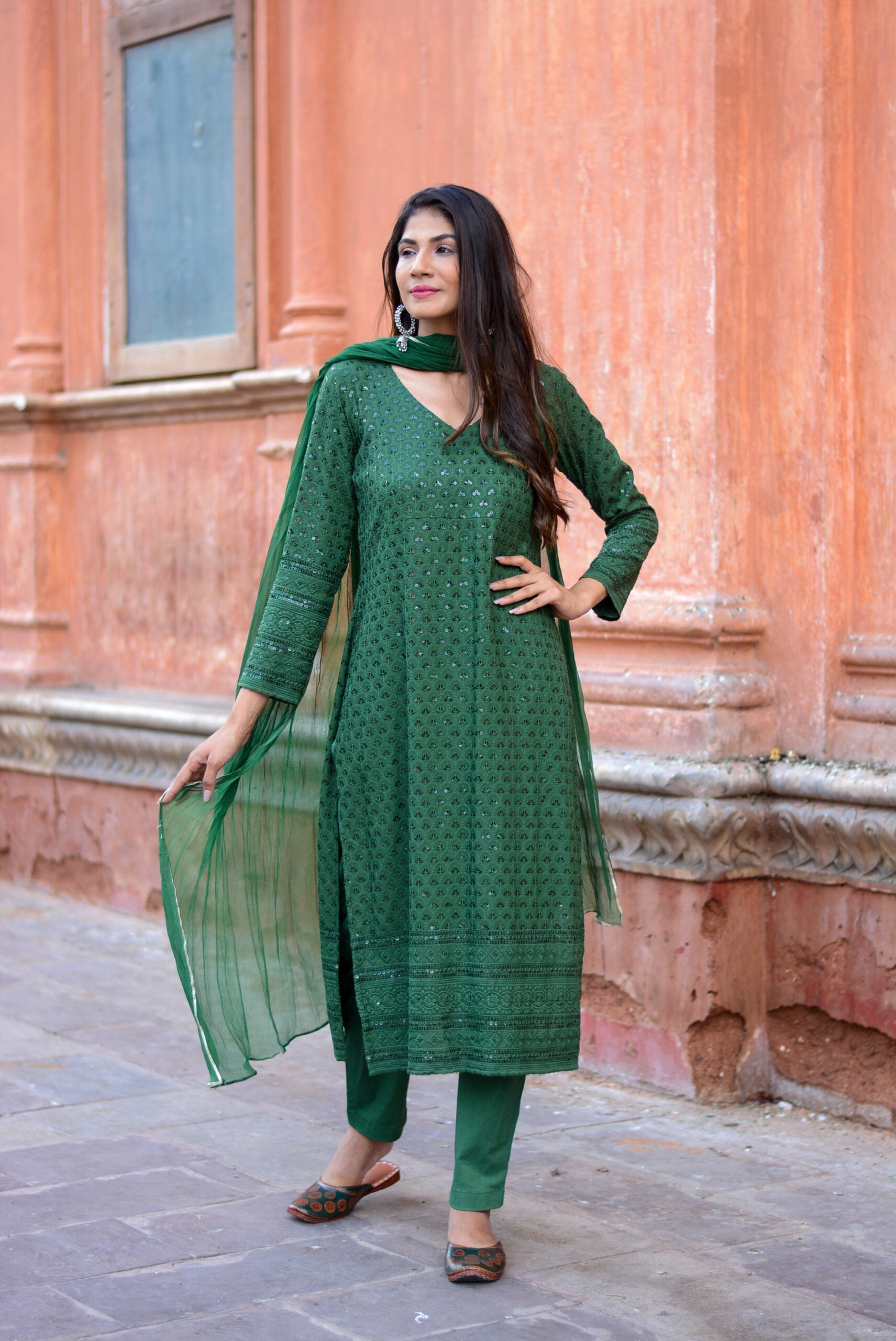 Elegant green three piece suit for women featuring detailed embroidery and matching dupatta by Stylera