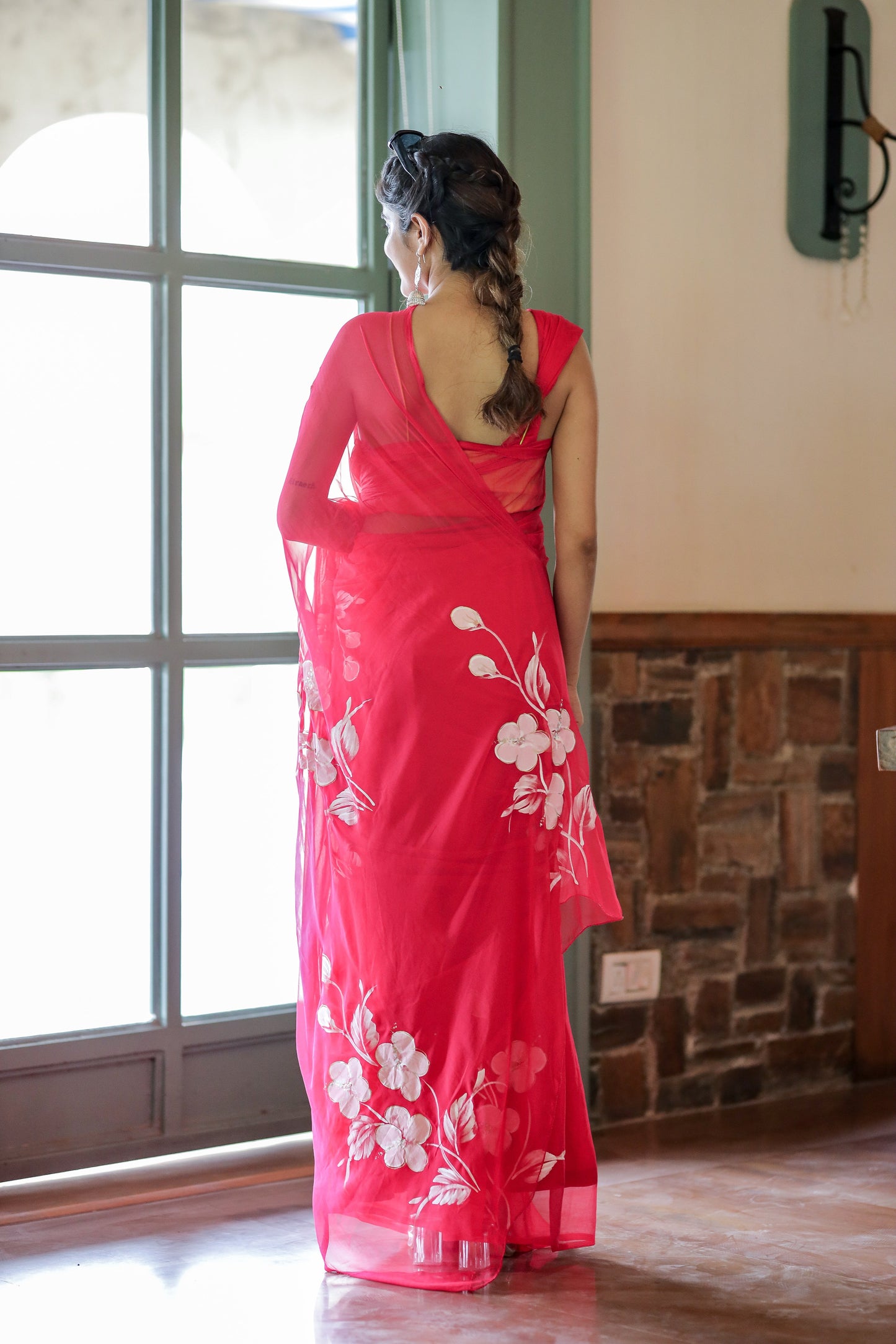 Elegant handpainted chiffon saree rani pink with floral designs for stylish occasions
