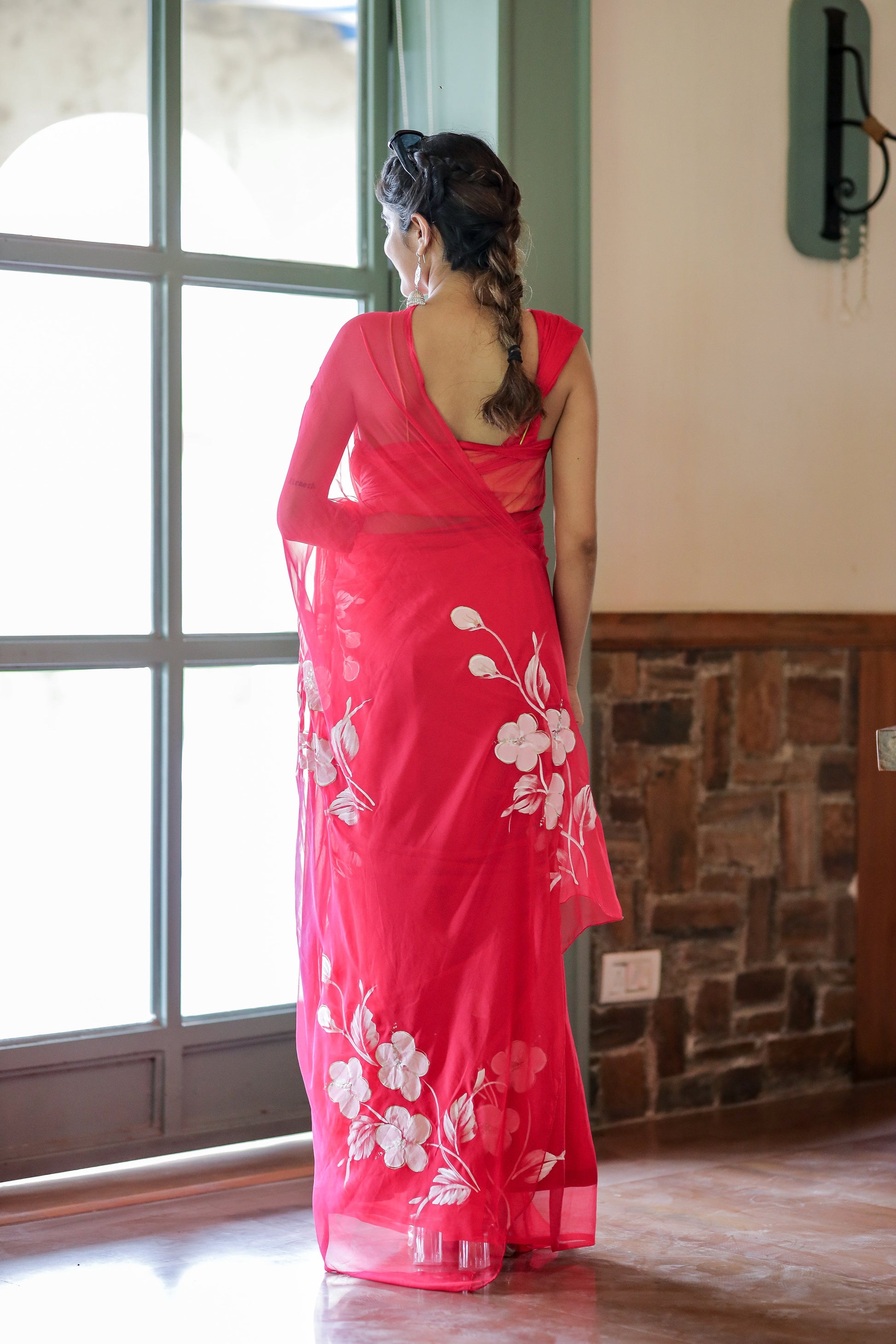 Elegant handpainted chiffon saree rani pink with floral designs for stylish occasions