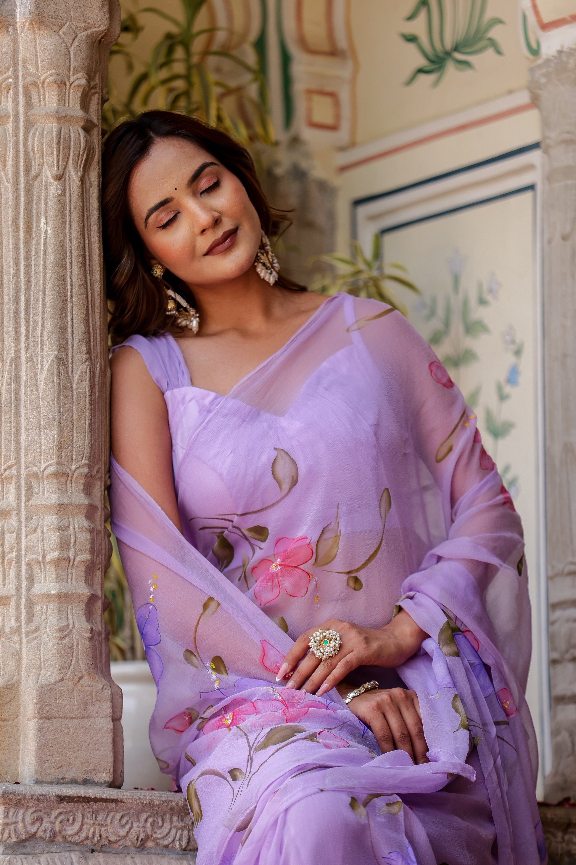Elegant handpainted lavender chiffon saree with floral designs, perfect for special occasions