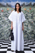 Stylera white cotton lace-up free size kaftan dress with V neck and front ties model holding black tote