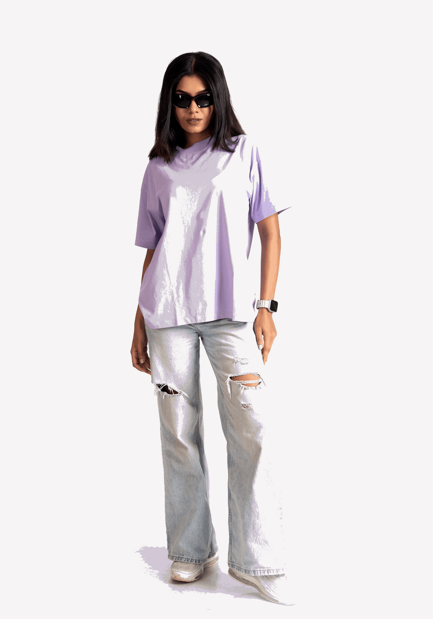 Stylera lavender oversized t-shirt worn by woman with ripped light jeans and sunglasses