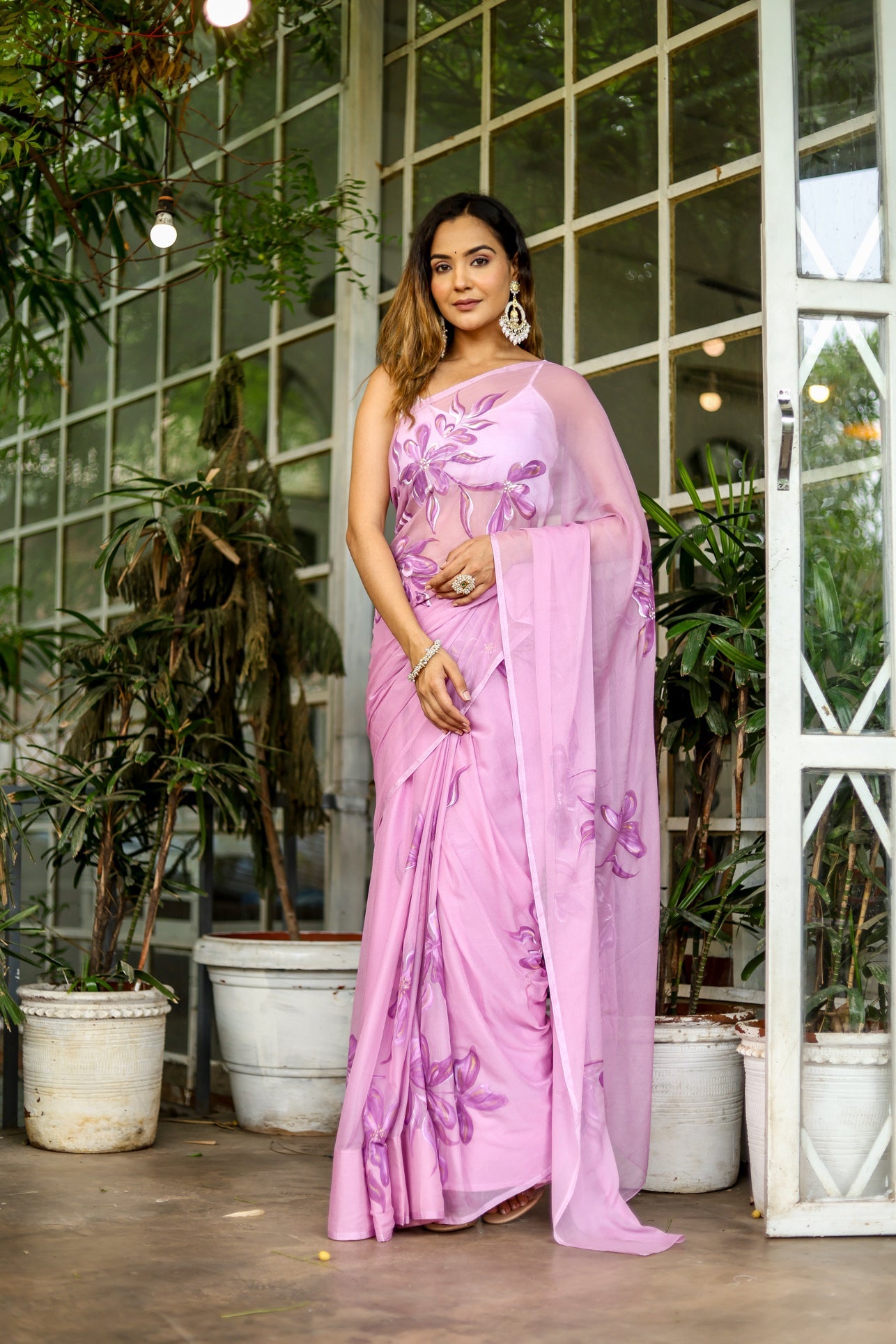 Light pink floral saree with intricate embroidery, perfect for elegant occasions and celebrations