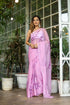 Elegant light pink floral saree with intricate designs, perfect for festive occasions and celebrations