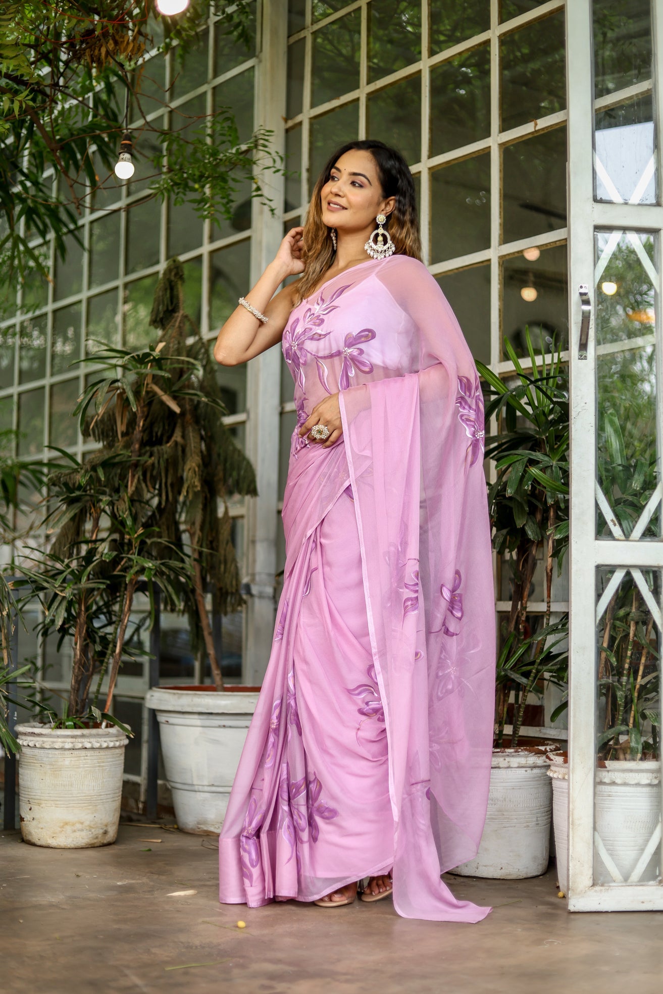 Elegant light pink floral saree featuring intricate embroidery and a matching dupatta