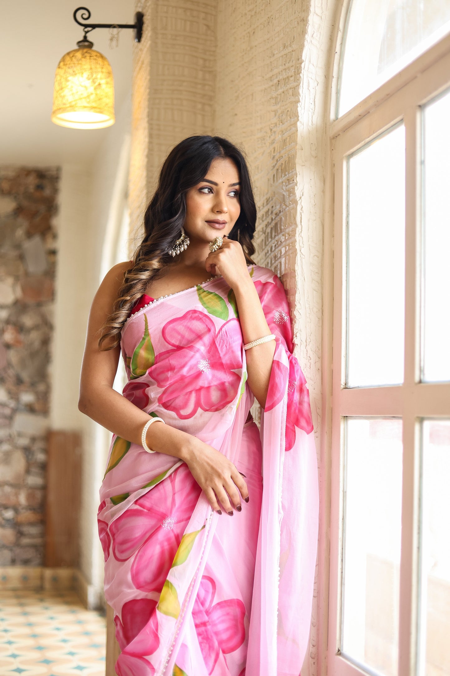 Beautiful lightweight party wear saree with pink floral prints, perfect for festive occasions