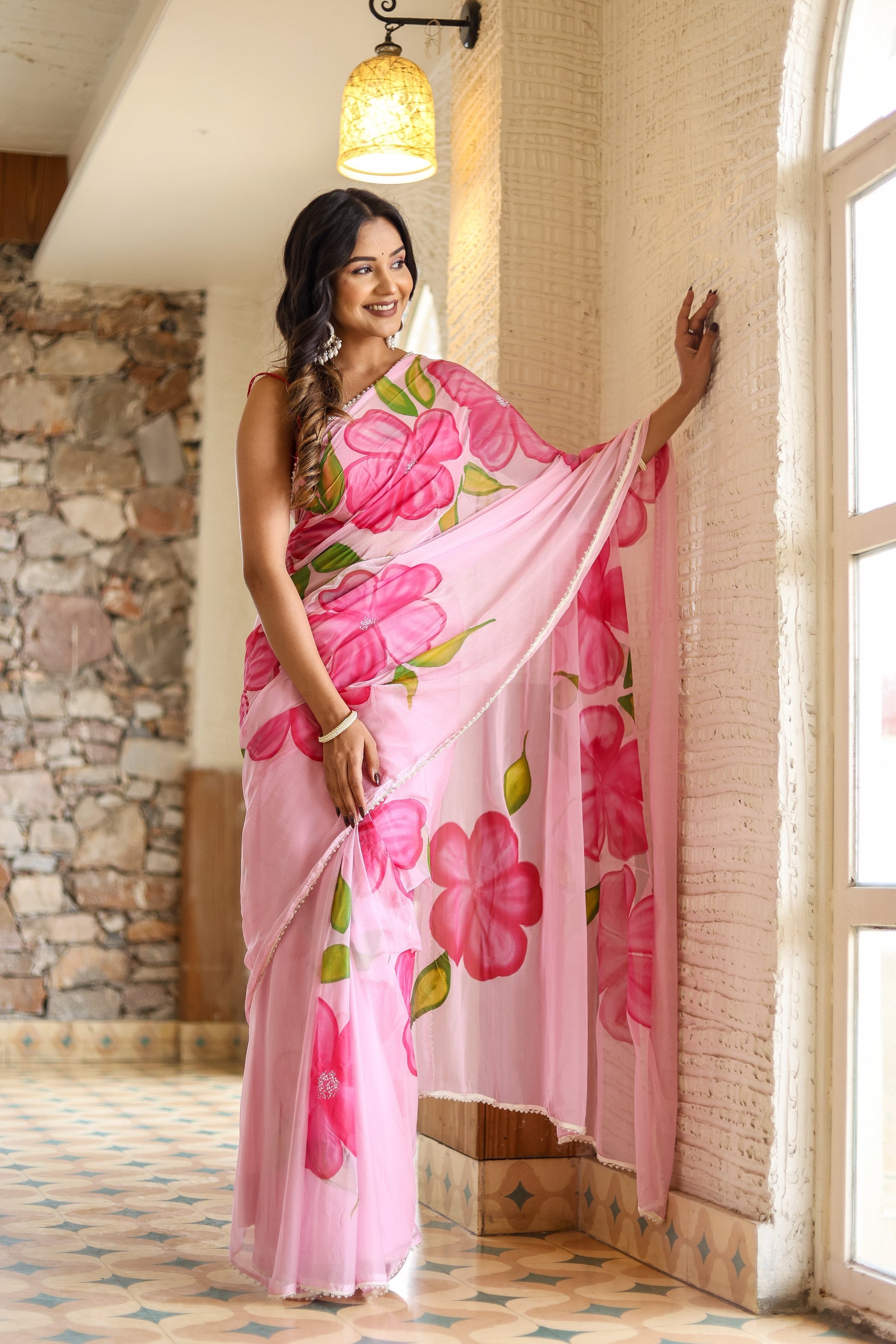 Elegant lightweight party wear saree in pink with floral designs, perfect for festive occasions