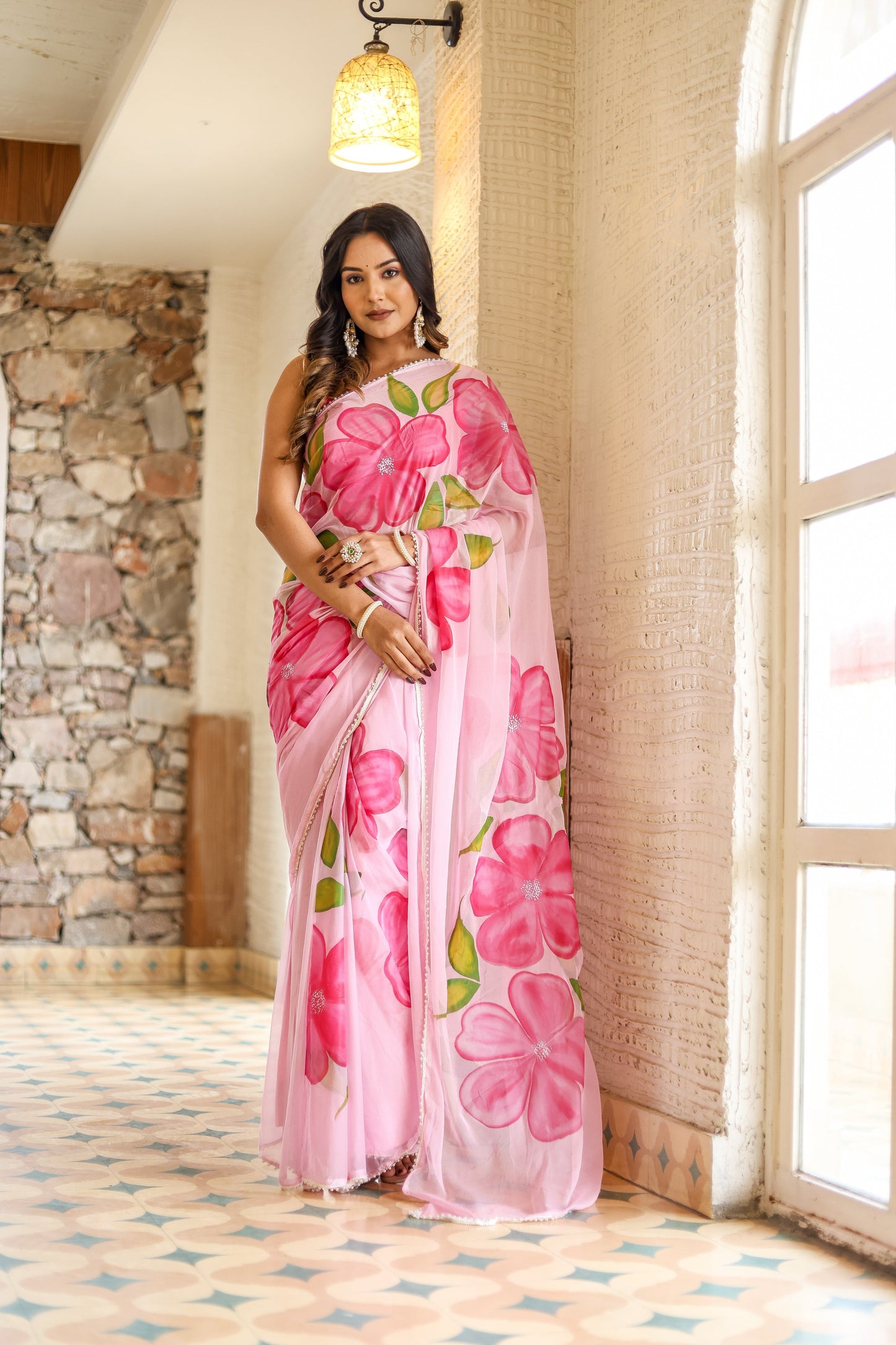 Beautiful lightweight party wear saree in pink with floral prints, perfect for festive occasions