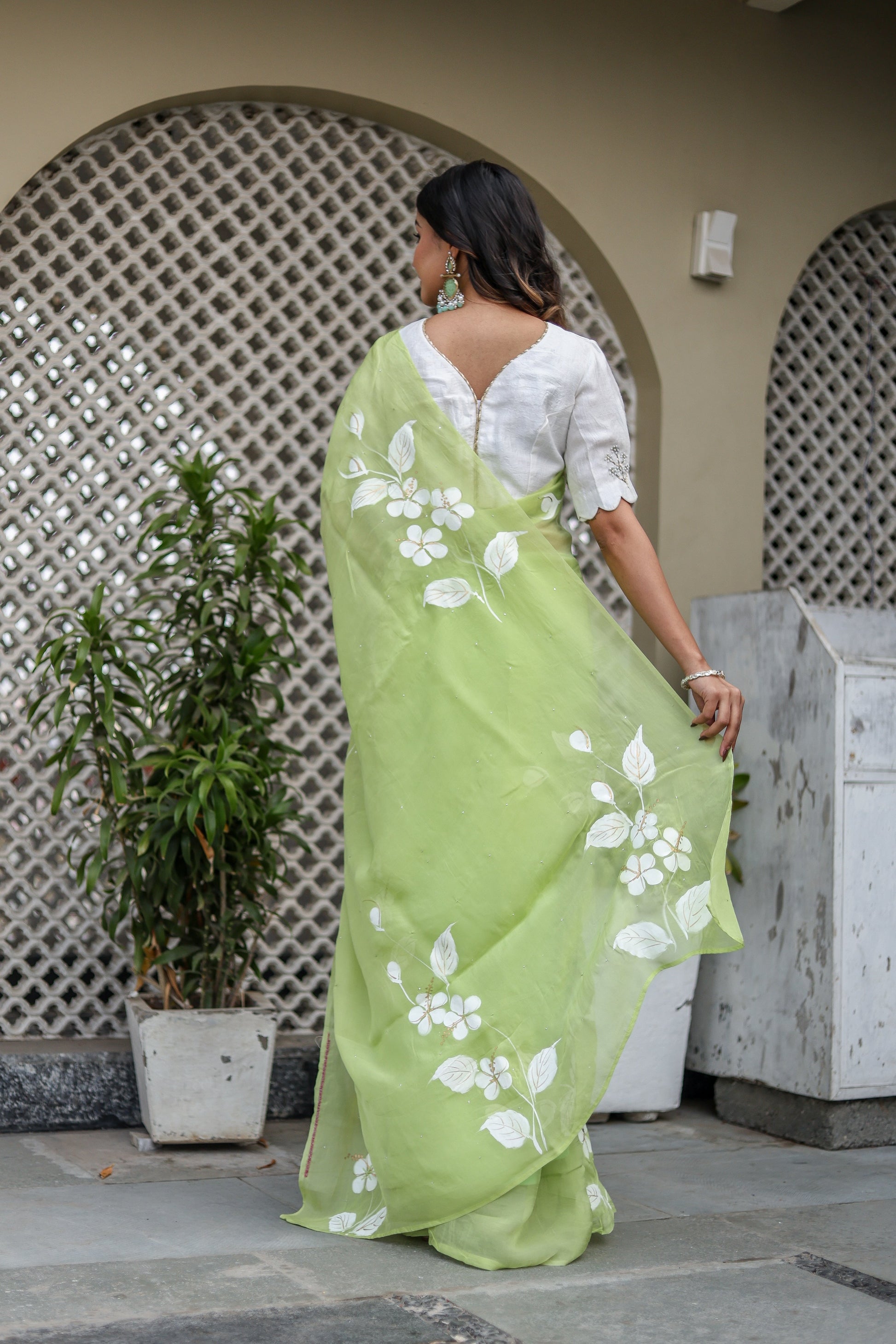 Elegant lightweight party wear saree in green with floral embroidery, perfect for festive occasions