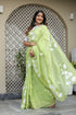Elegant lightweight party wear saree in light green with floral embroidery, perfect for festive occasions