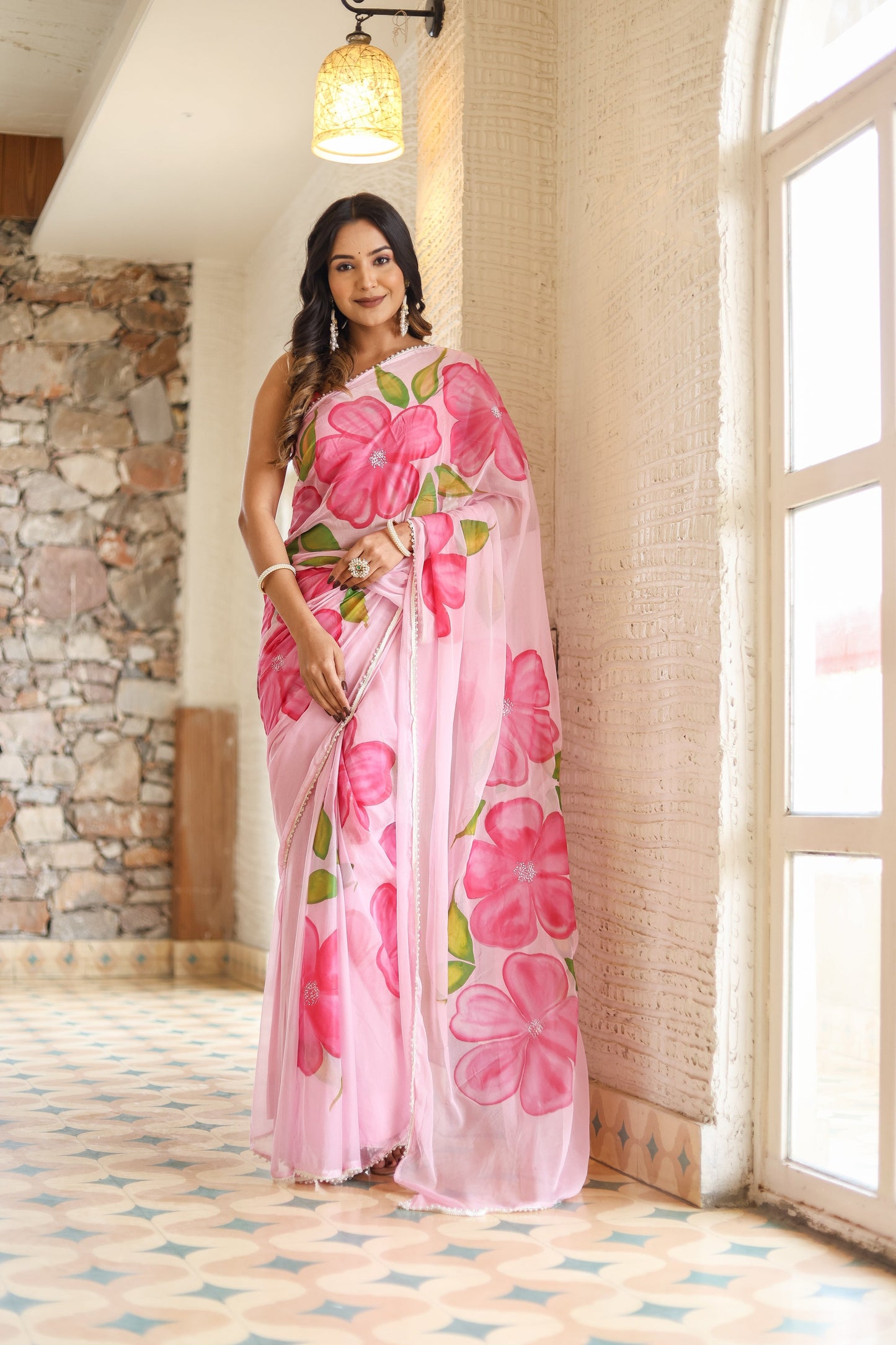 Elegant lightweight party wear saree in pink with floral design, perfect for festive occasions