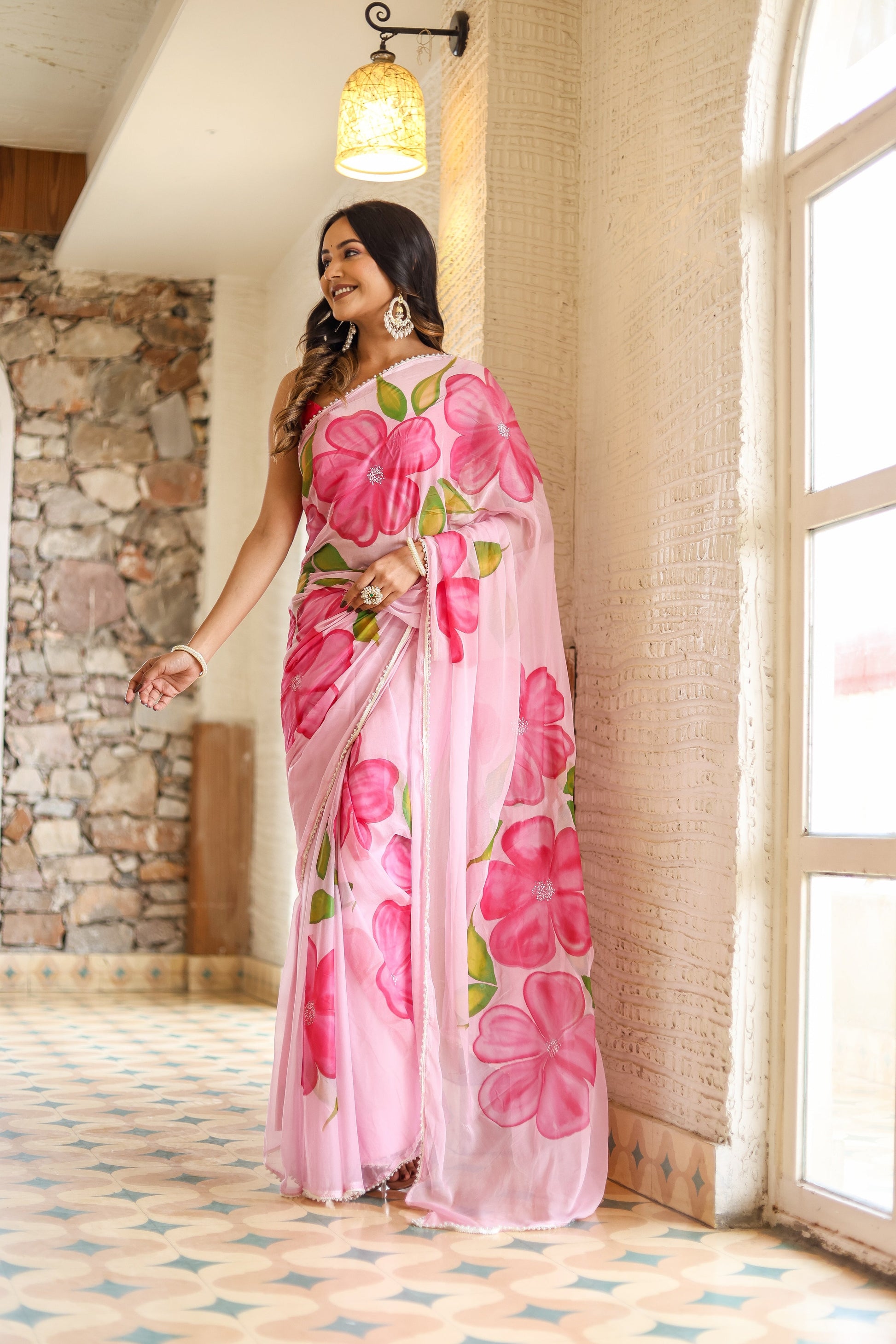 Beautiful lightweight party wear saree in pink with floral designs, perfect for festive occasions
