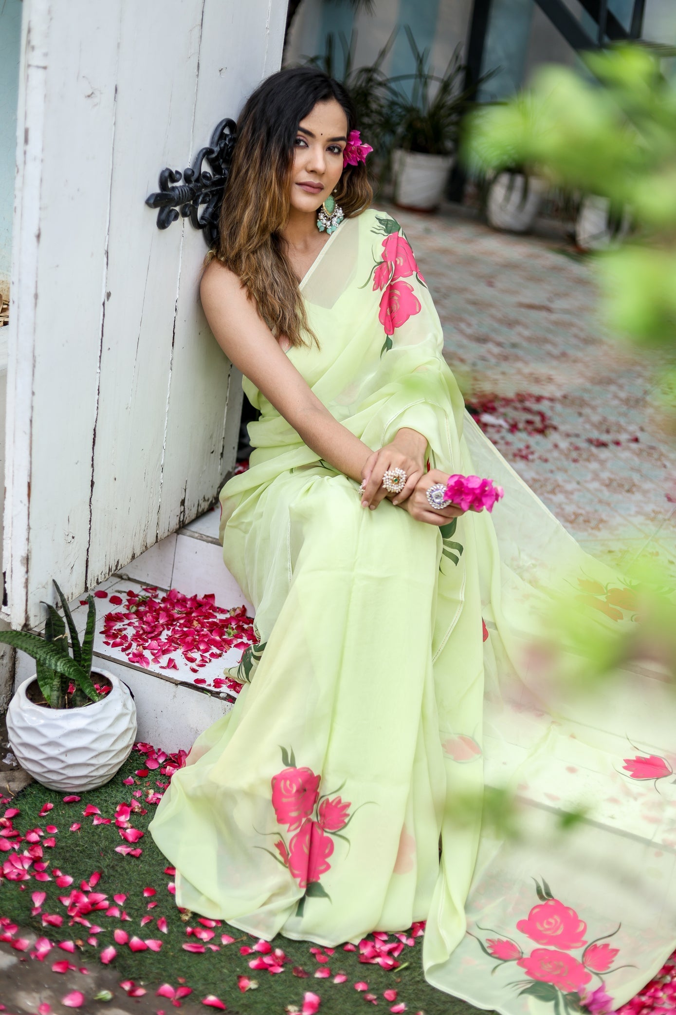Lightweight pastel saree with floral print in soft green, perfect for casual occasions and festive celebrations