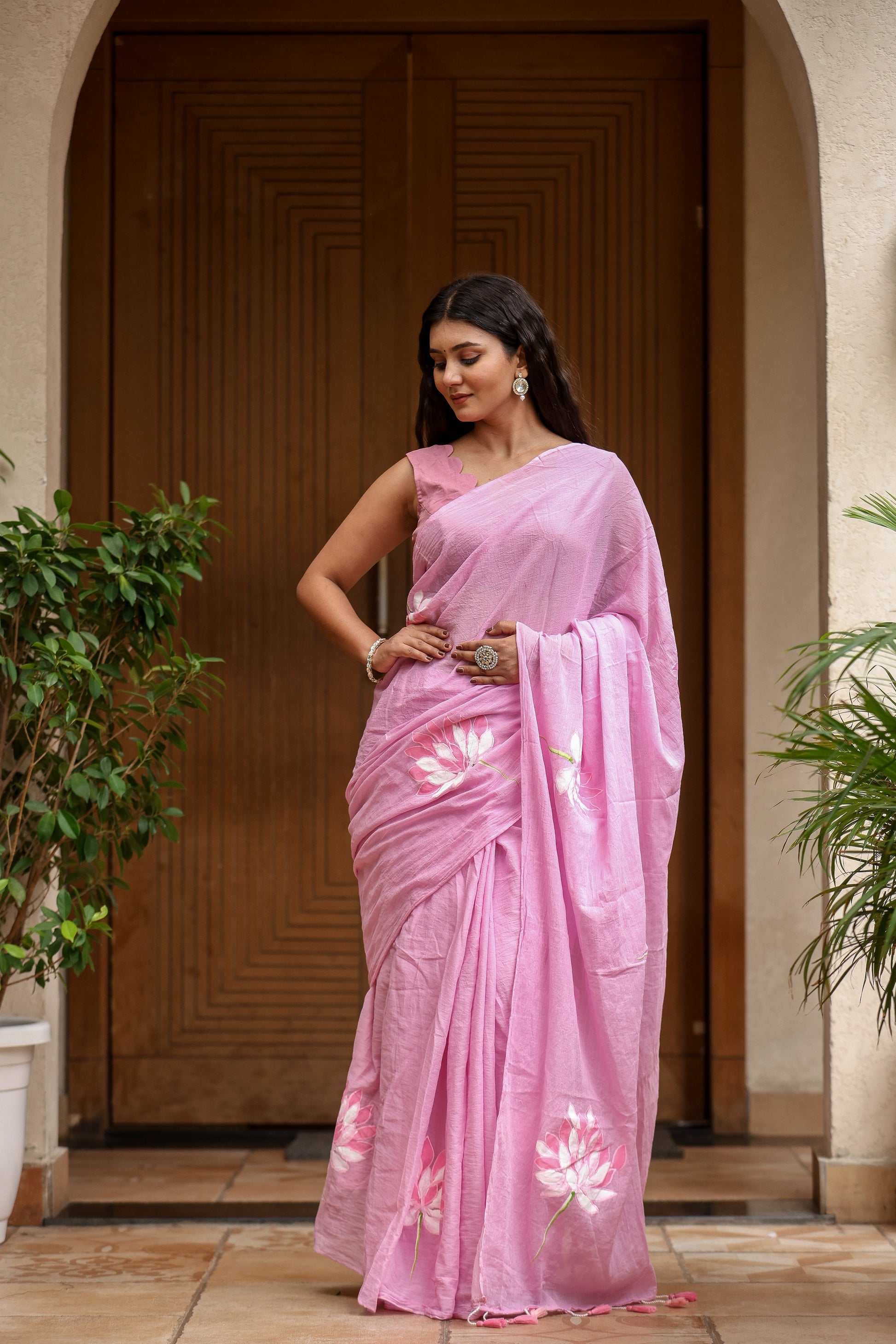 Elegant lightweight summer saree for women in pink with floral embellishments, perfect for warm weather occasions